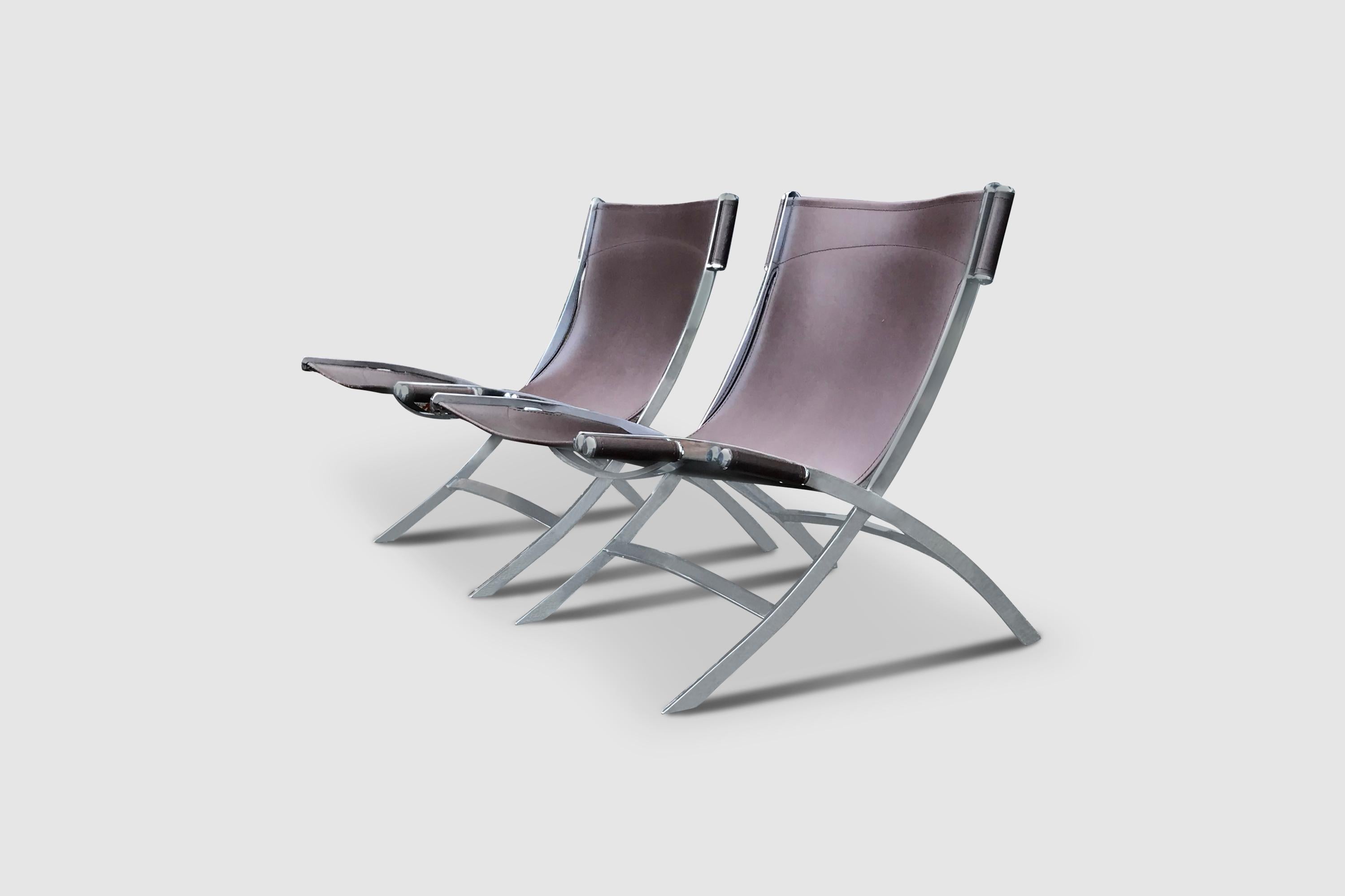 A scissor lounge chair, widely attributed to designers Paul Tuttle and Antonio Citterio for Flexform Italy.

The frame consists of one piece of solid chromed steel. The leather patch is fixed to the frame on 6 points by chrome cylinder shaped