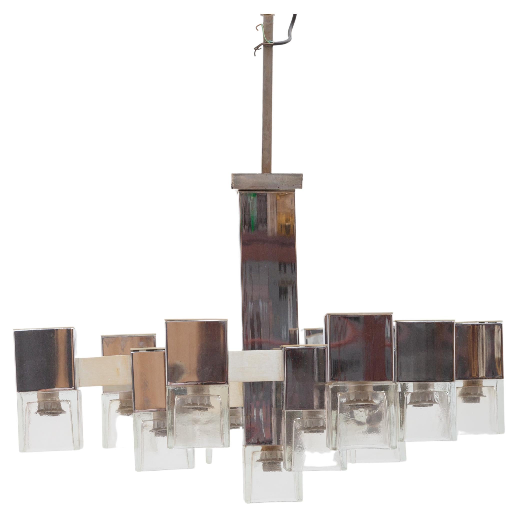 Cubic large hanging twelve bulbs chandelier designed by Gaetano Sciolari. The chandelier has a geometric chrome-finished steel body and frosted glass shades. The quality chrome frame consists of twelve polished chrome cubic rectangles attached by