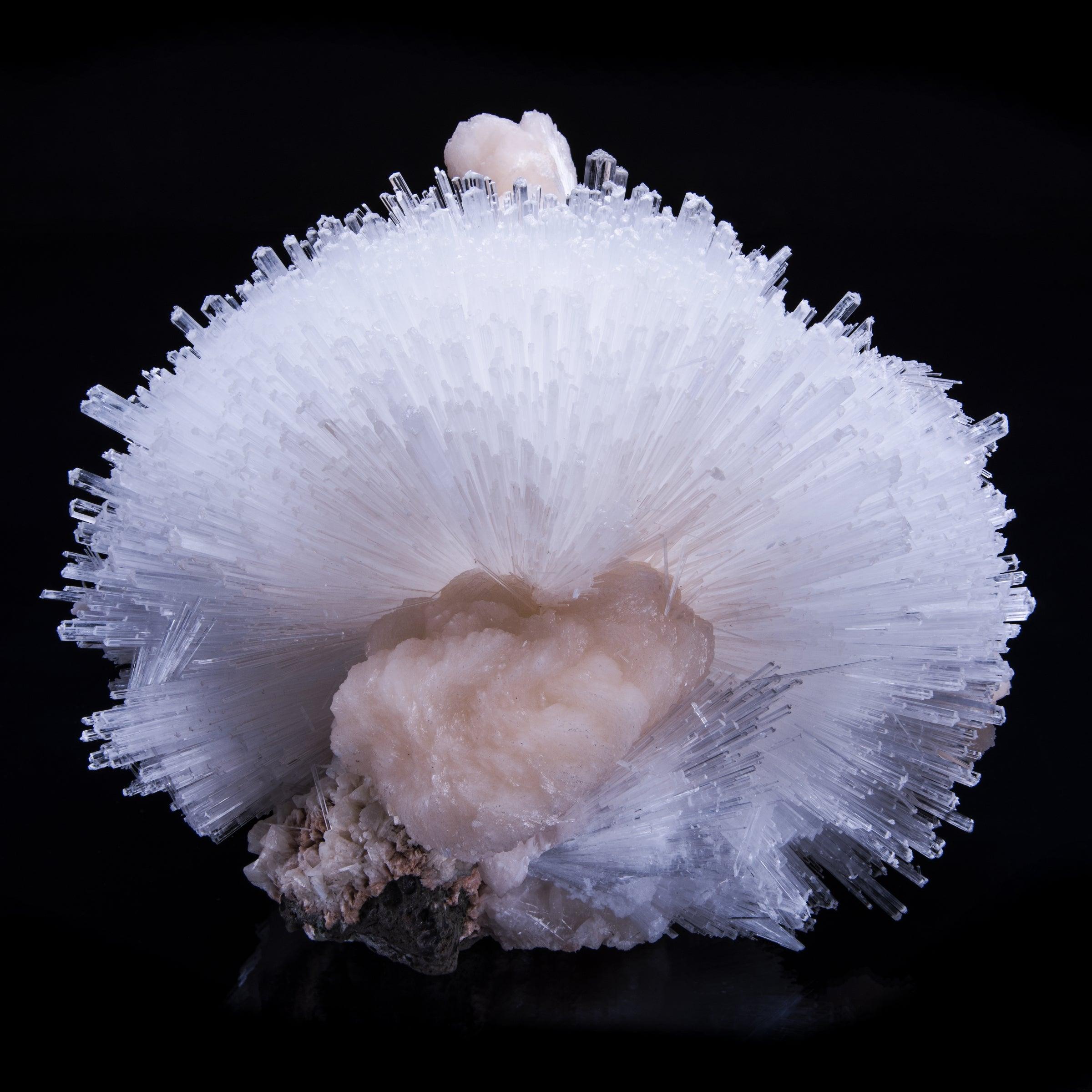 A more recent find out of the mine in Puna, India from 2016, the scolecite wraps nearly three sixty degrees around a peach-colored stilbite matrix. A delicate fiber optic explosion that is endlessly beautiful when viewed from every
