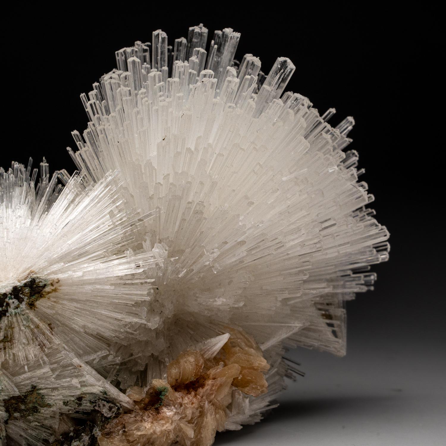From Nasik District, Maharashtra, India

Large lustrous cluster of an acicular sprays of scolectite crystals on pink stilbite. The scolecite crystals have glassy crystal faces and are mostly translucent to transparent at the terminations.


Weight: