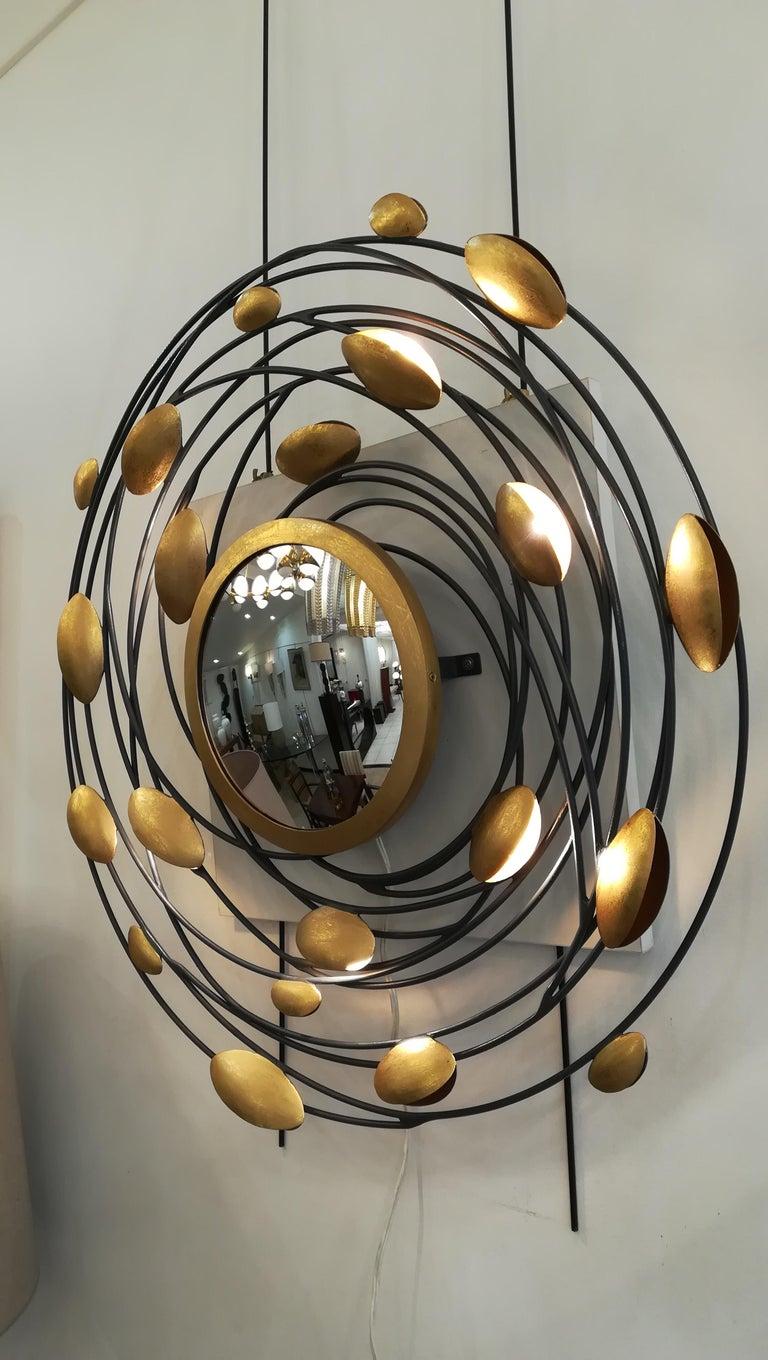 Metal Sconce and Mirror Illuminated by Lightning Gold Shells For Sale