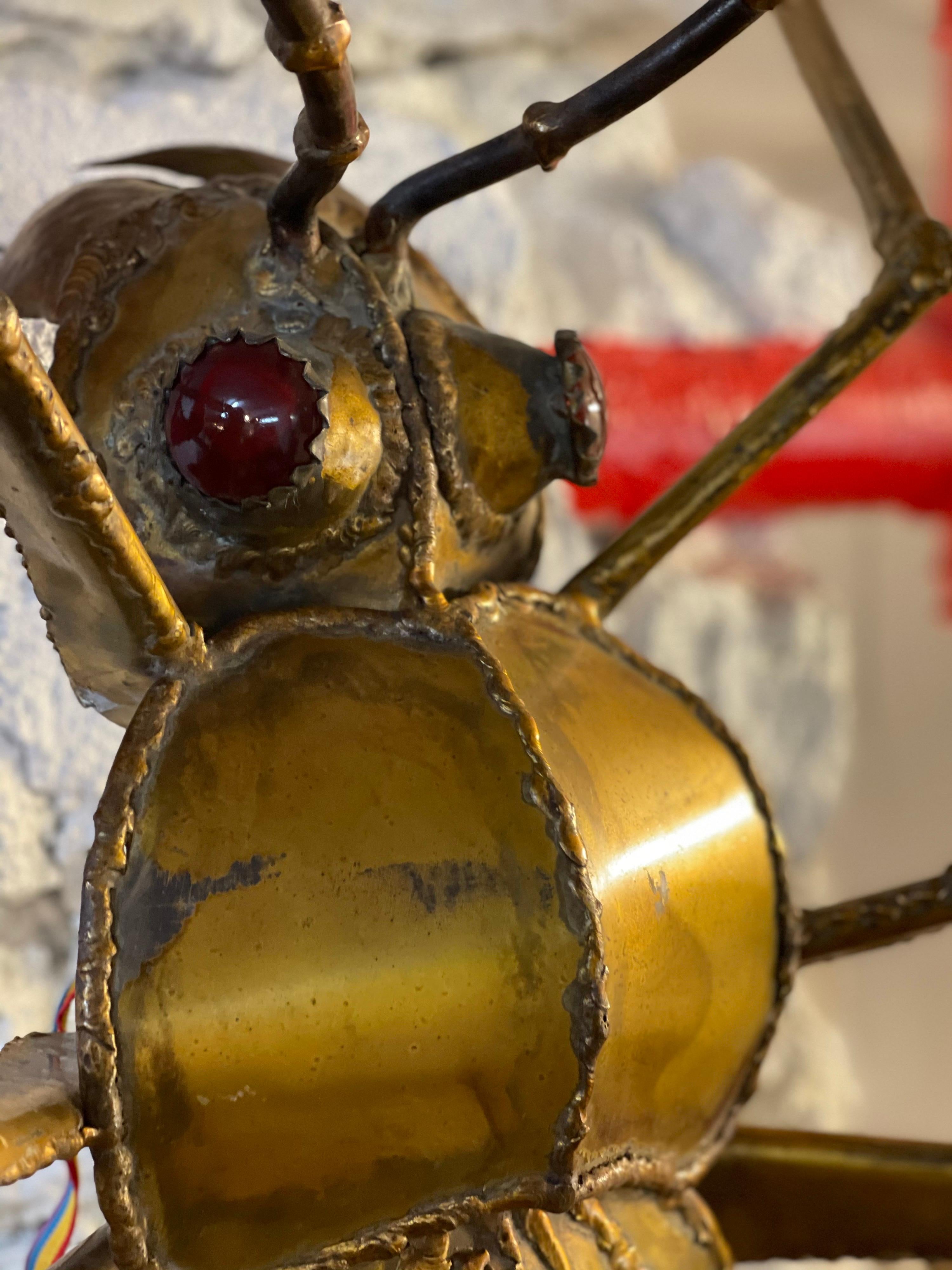 A huge brass beetle sconces with agate eyes by Duval Brasseur.