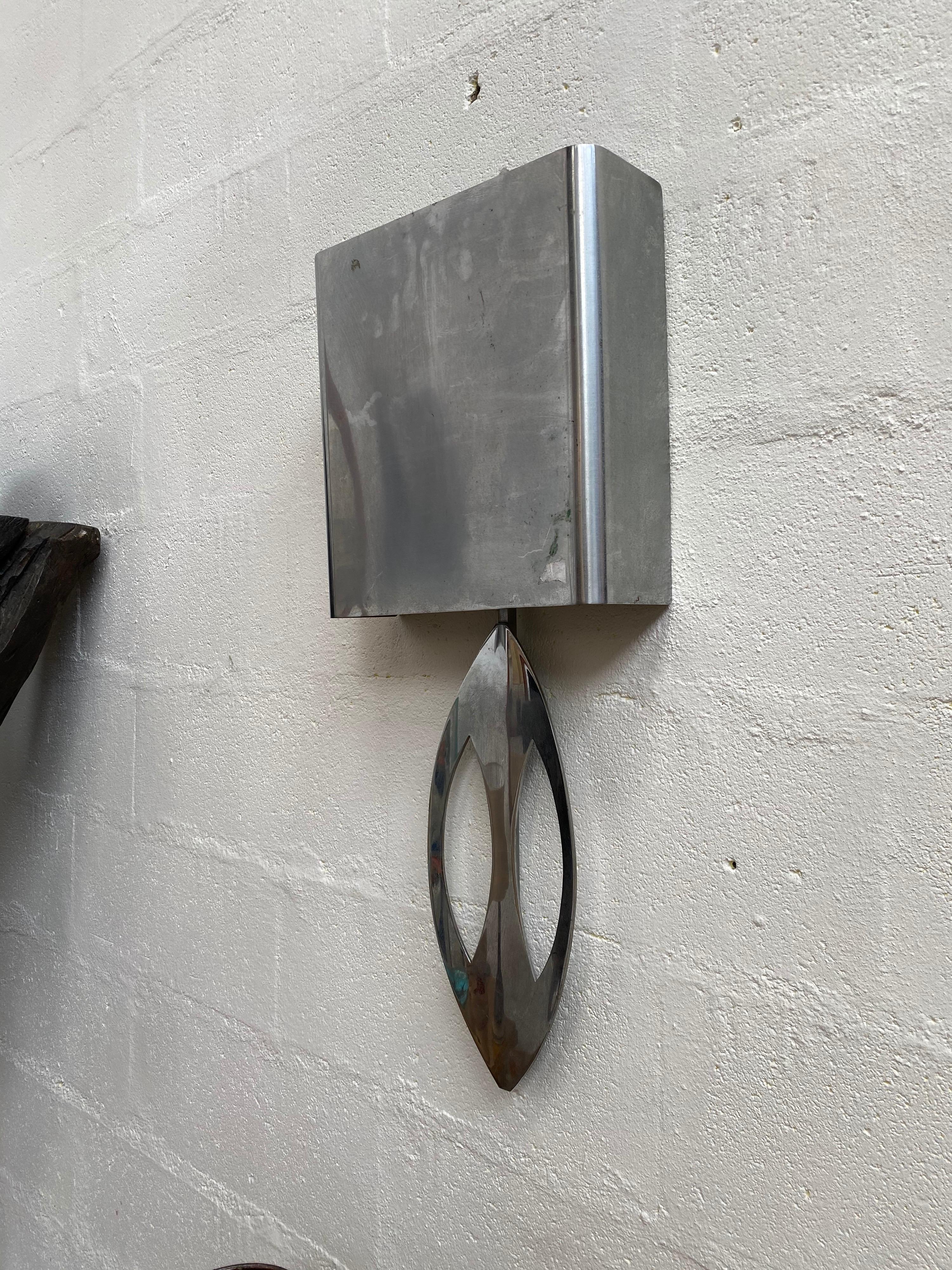 Large stainless steel sconce signed Maison Charles, circa 1970.