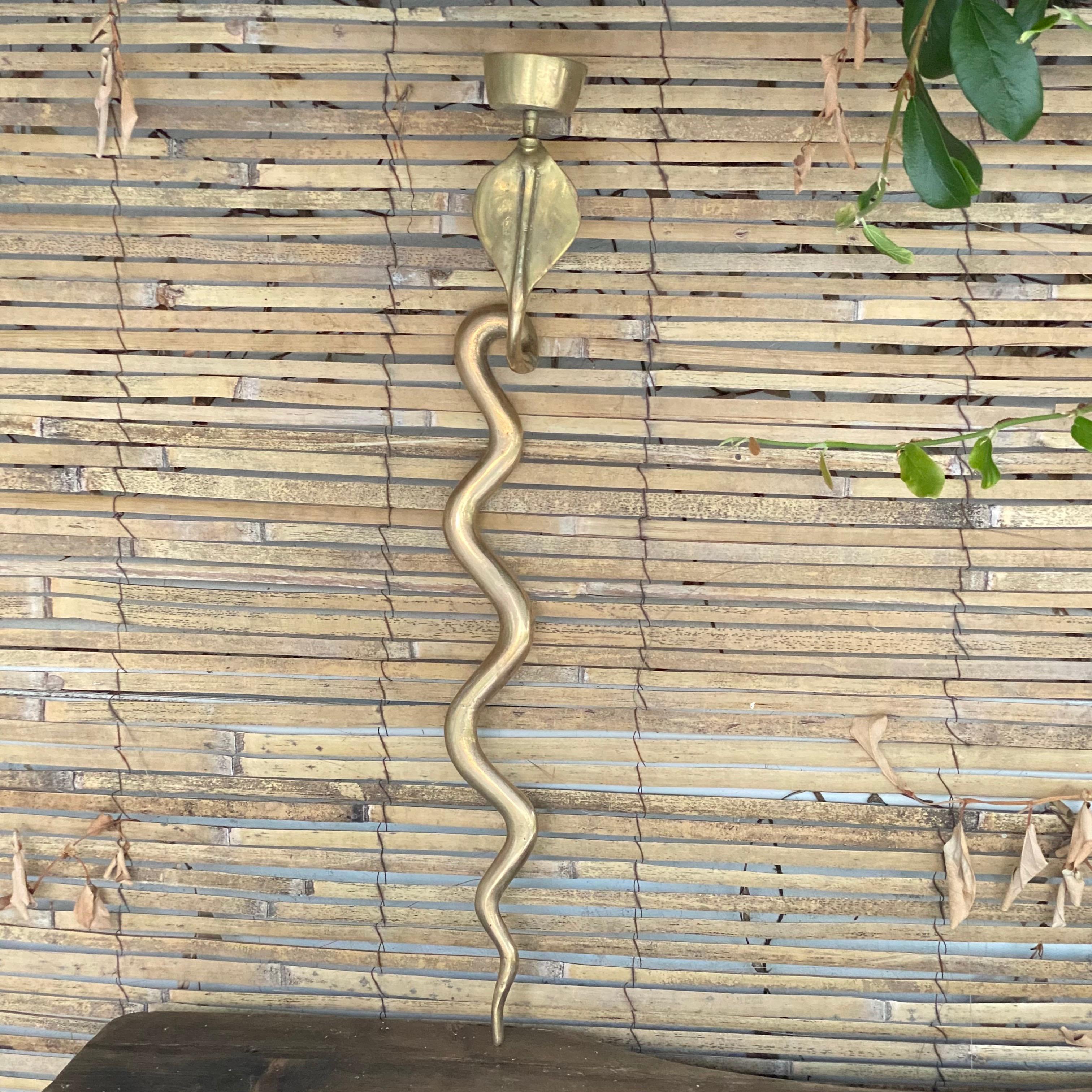 This sconce is in bronze. It has been made in France in the 1960's.
It is in a good condition.
 
