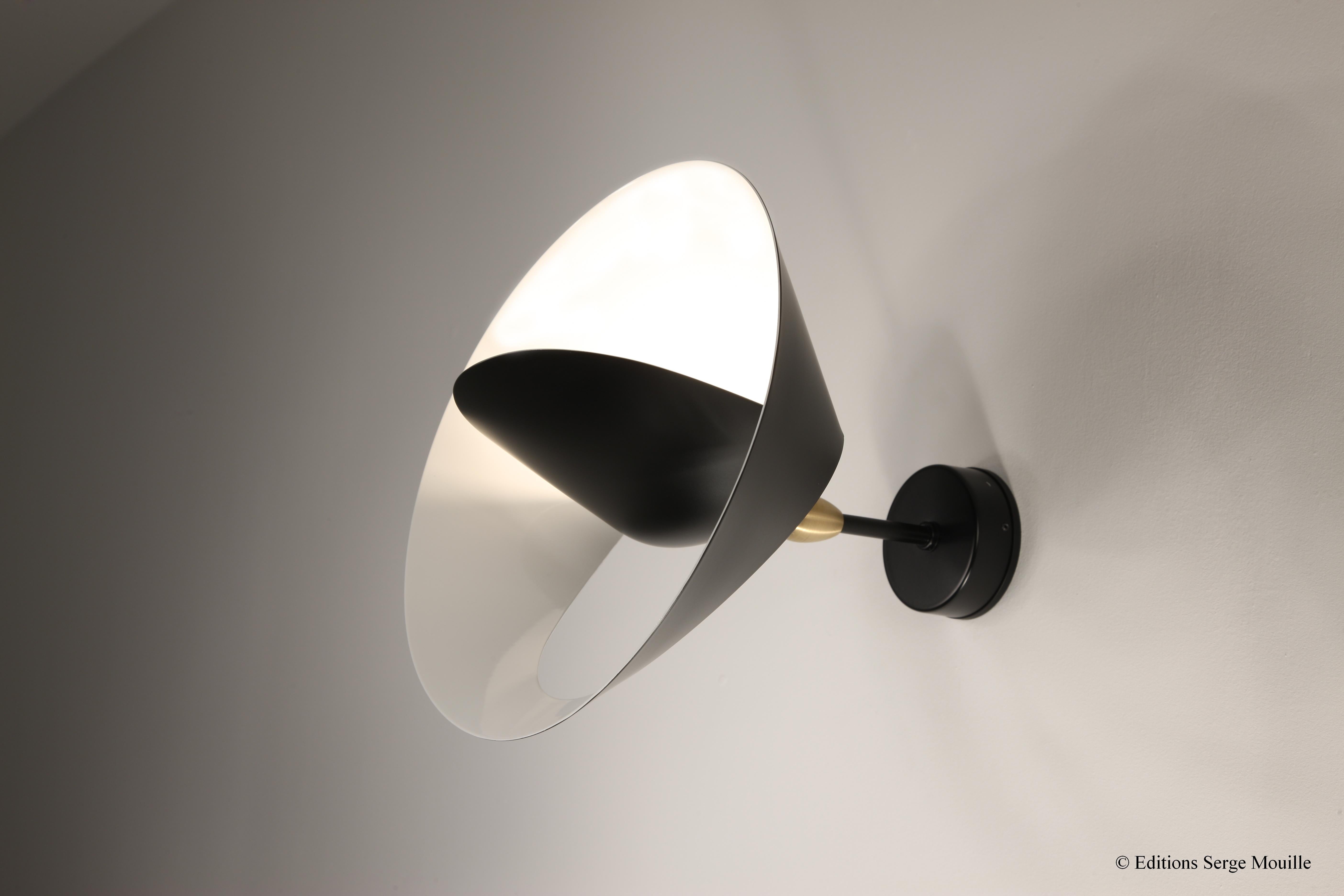 Sconce Saturne by Serge Mouille
Dimensions: D 30 x H 26 cm
Materials: Brass, steel, aluminium
One of a King. Numbered.
Also available in different colour.

All our lamps can be wired according to each country. If sold to the USA it will be