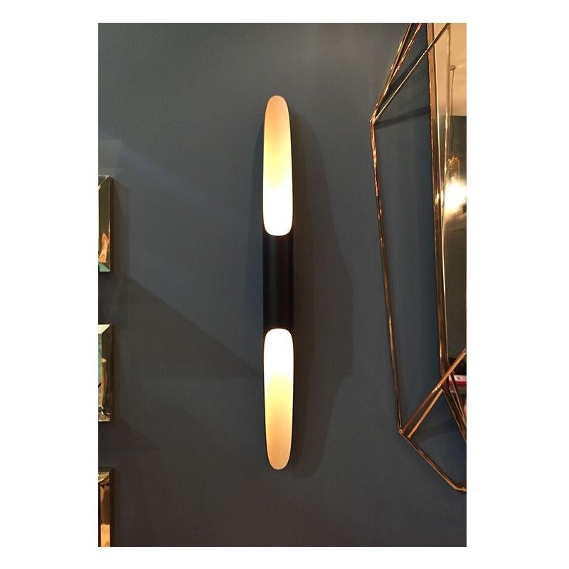 This wall light fixture has matte black and gold powder paint finishes, which give it a more contemporary style. It is prepared to be used in more humid atmospheres, making it the perfect outdoor sconce.
Measures: Width: 3.1“ 8 cm

Height: 39.4”