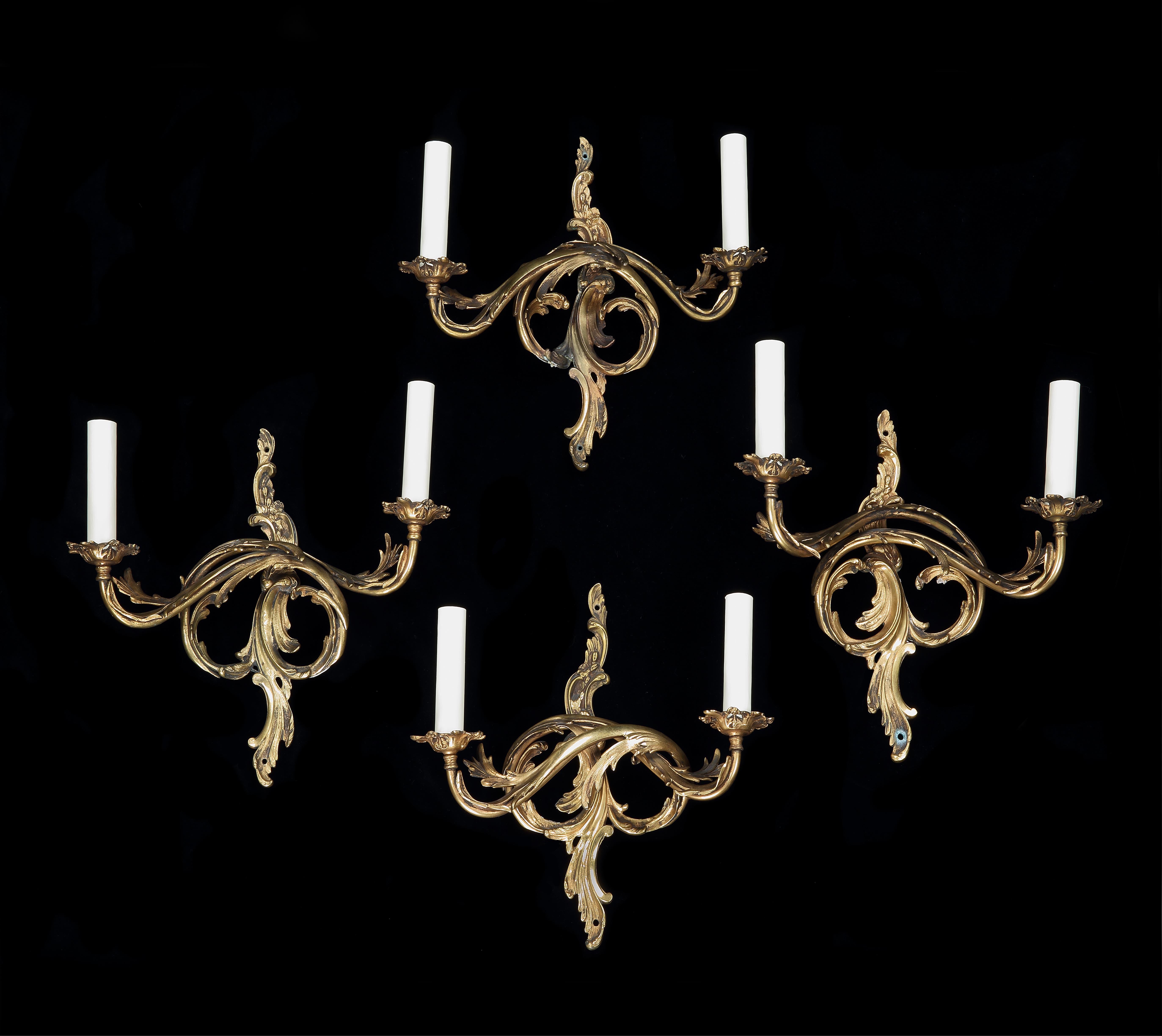 A set of four, Italian, ormolu, neoclassical, two arm/branch, electrified, acanthus leaf, wall sconces,

-Fluid, naturalistic, classical form, in one continuous, scrolling piece
-Fluid acanthus leaf form in one piece with the branches projecting