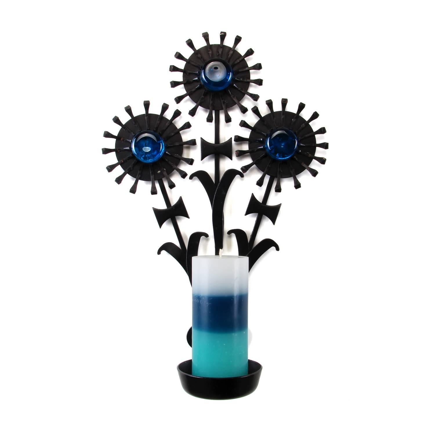 Sconce, wrought iron by Dantoft Kunstartikler, Denmark, circa 1960s, beautiful and sculptural black candleholder with three blue glass stones, in very good vintage condition.

A sculptural sconce made in black lacquered, welded wrought iron and
