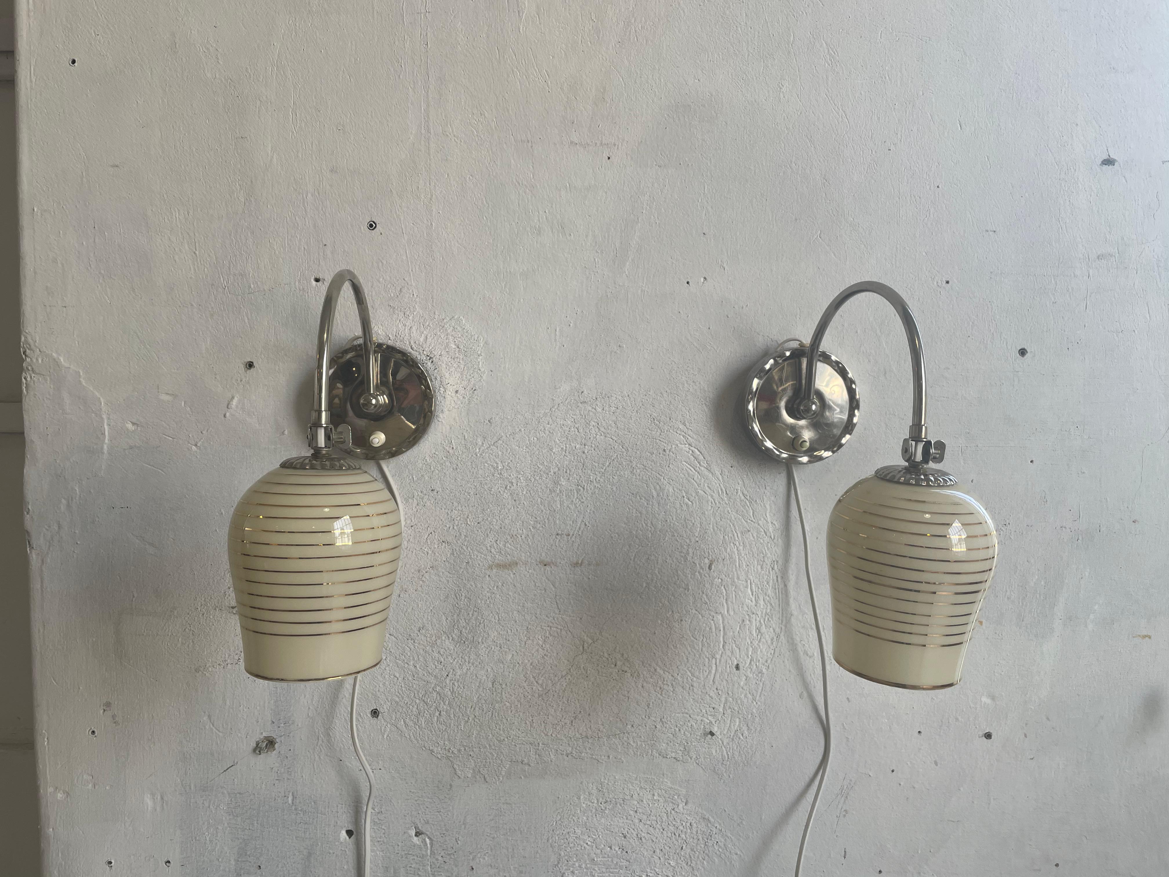Very nice pair of wall lamps from the 60s by the famous designer paavo tynell edited by idman identified by the number 61032 under the exact nomenclature 