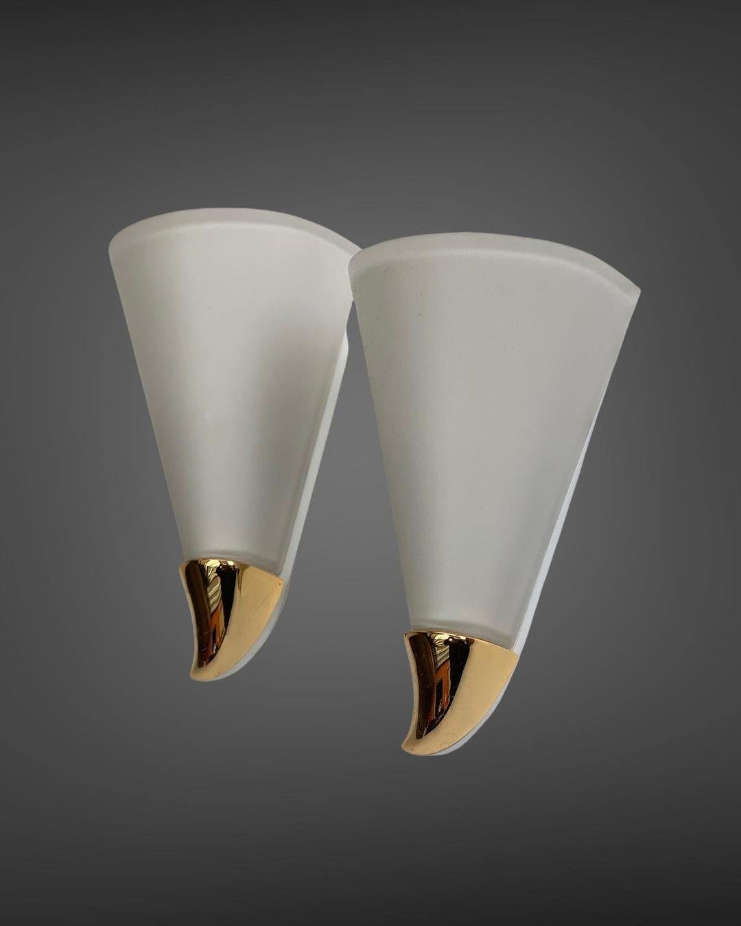 - Pair of sconces from the Belgian company Deknudt
- Well suited for the bathrooms
- Made of opaline glass and brass
- Circa 2000s.