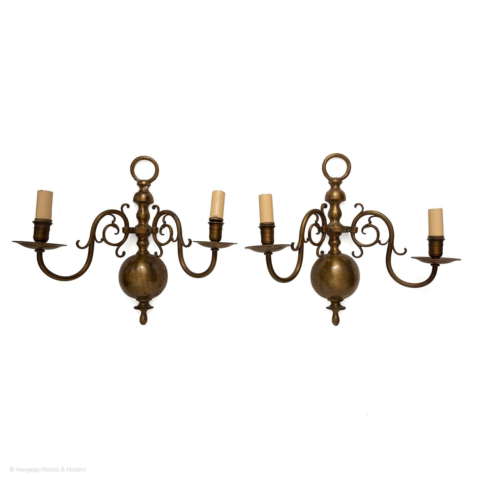 Characterful pair of sconces injecting atmosphere into the interior
Stylish classic form with characteristic Dutch split turned backs and large scrolling arms
Electrified

Measures: Length 39cm., 15