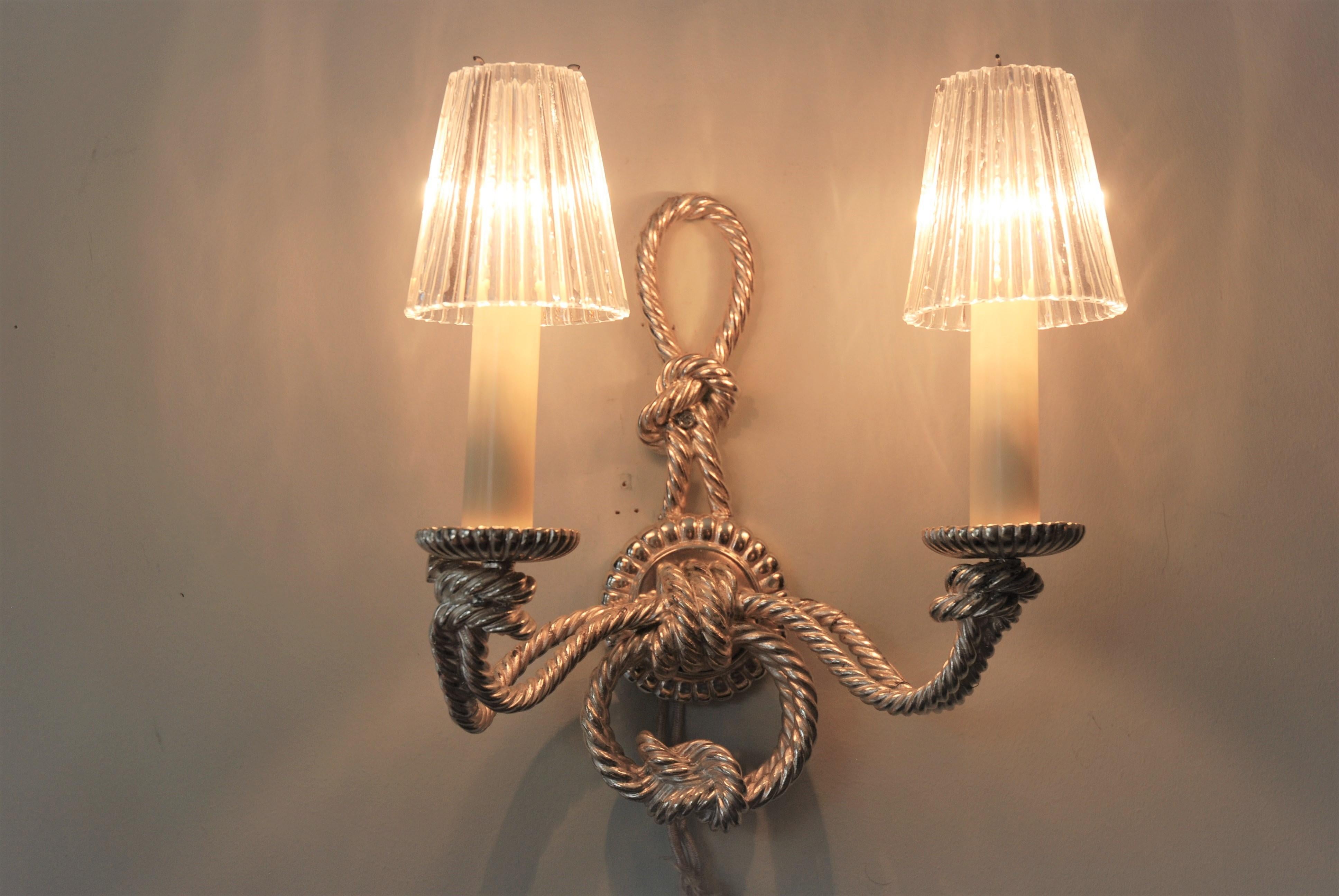 Pair of French sconces - silver color twisted metal in a cord style
Glass lampshades included.