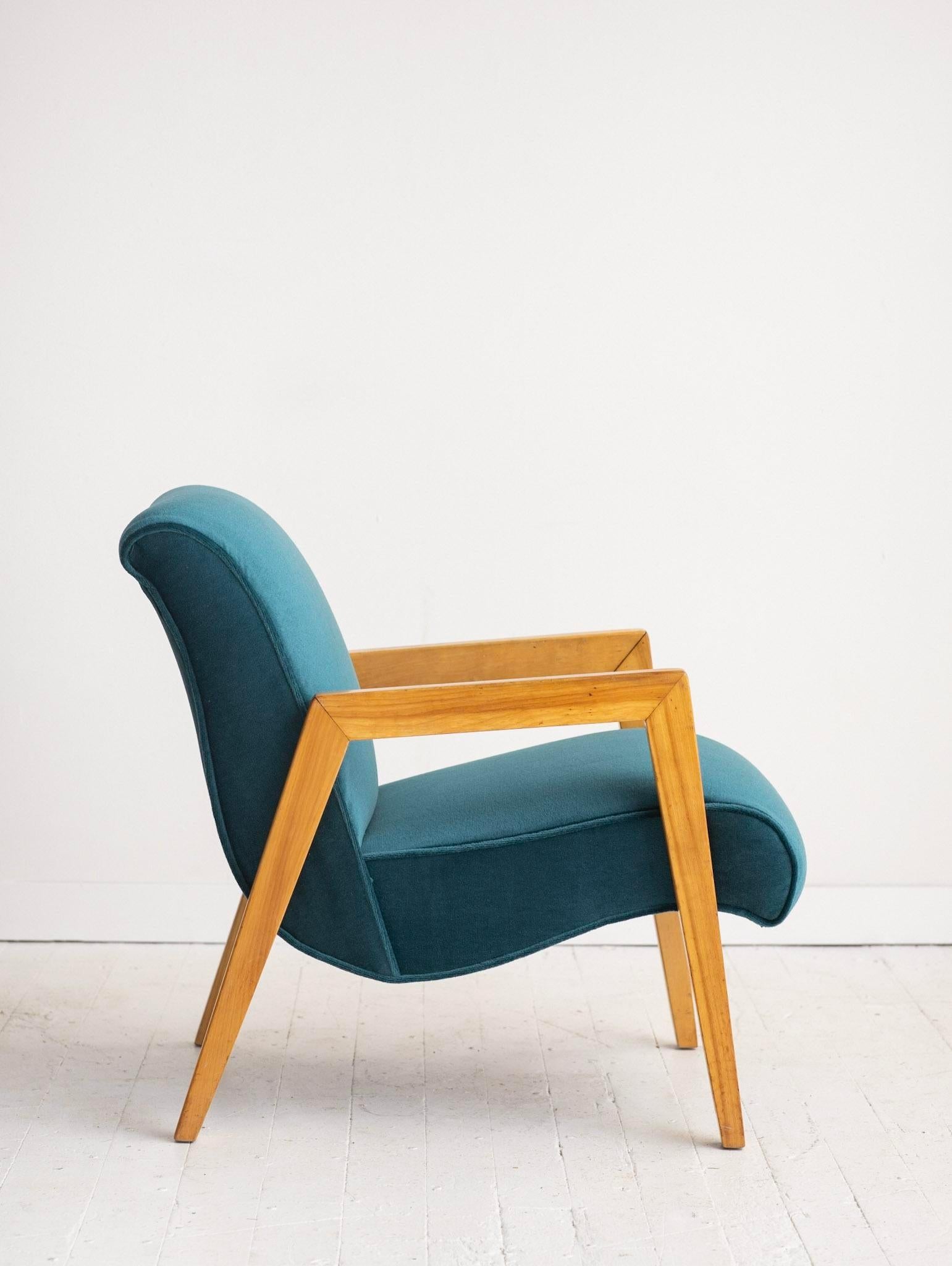 Scoop chair by Leslie Diamond for Conant Ball. Reupholstered in teal mohair. Blonde wood frame.
There is no tag found on this chair. It has been reupholstered and the upholsterer did not keep it. Arm height is 21.5