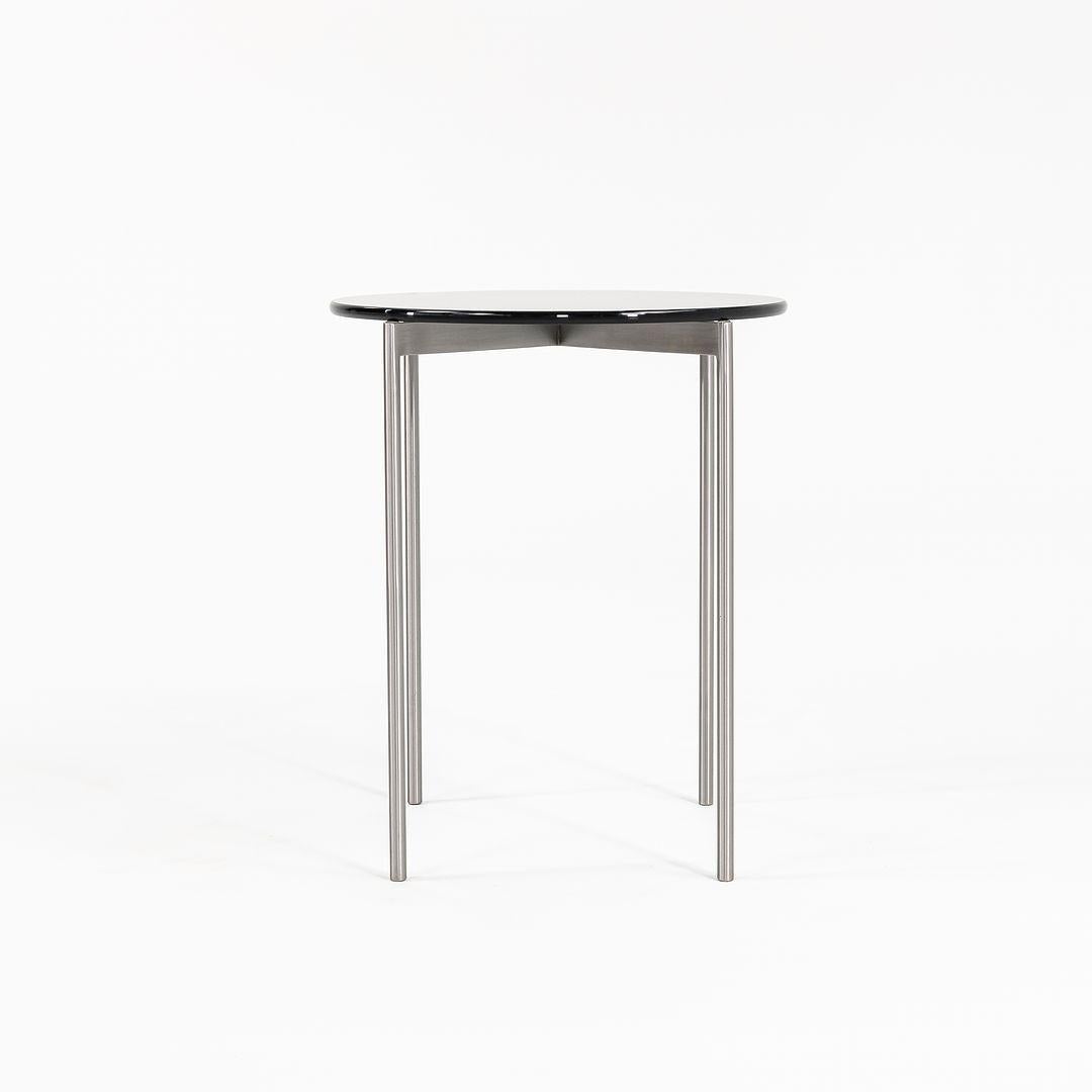 These are 2 (two) hand-made solid stainless steel side tables by Gratz Industries from the Scope series that Gratz produced from 1980-2010. The tables were used as showroom models in Gratz's Philadelphia showroom and they appear to be in superb