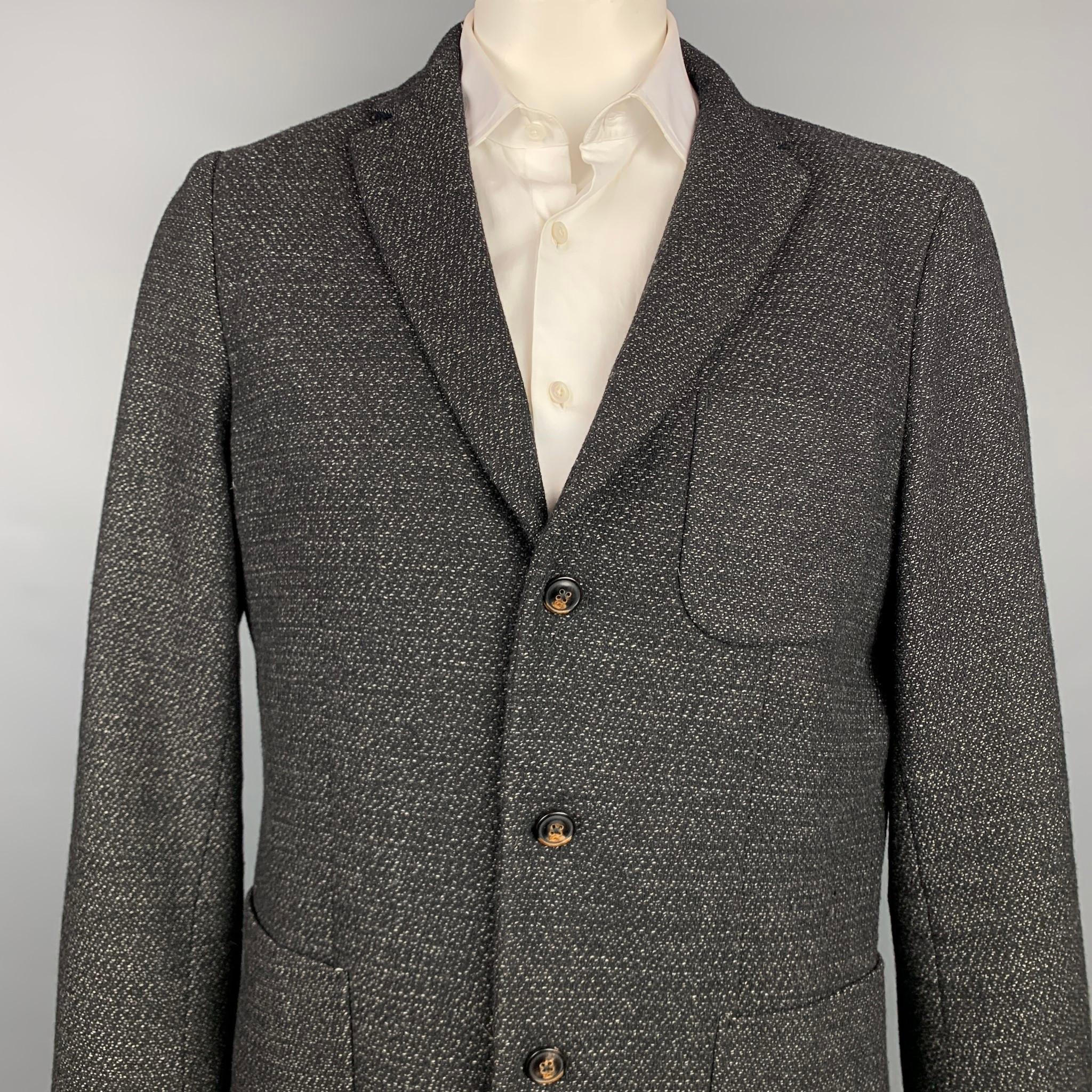 SCOTCH AND SODA sport coat comes in a black & white wool / polyester with no liner featuring a notch lapel, tailored fit, patch pockets, and a three button closure.

Very Good Pre-Owned Condition.
Marked: XXL/54

Measurements:

Shoulder: 19
