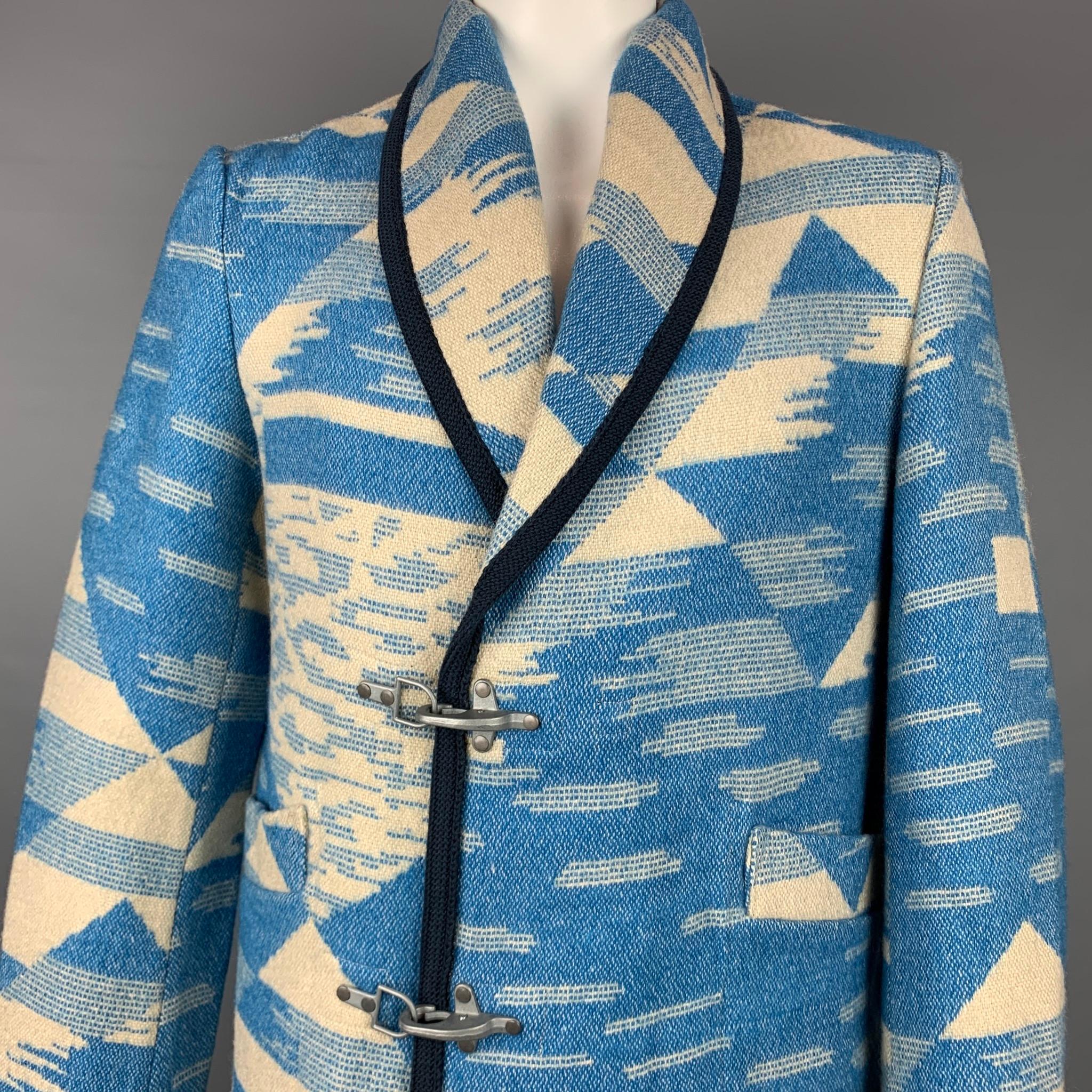 SCOTCH & SODA coat comes in a blue & cream navajo acrylic blend featuring a shawl collar, patch pockets, unlined, and a metal hook closure. 

Very Good Pre-Owned Condition.
Marked: XL

Measurements:

Shoulder: 18 in.
Chest: 46 in.
Sleeve: 28.5