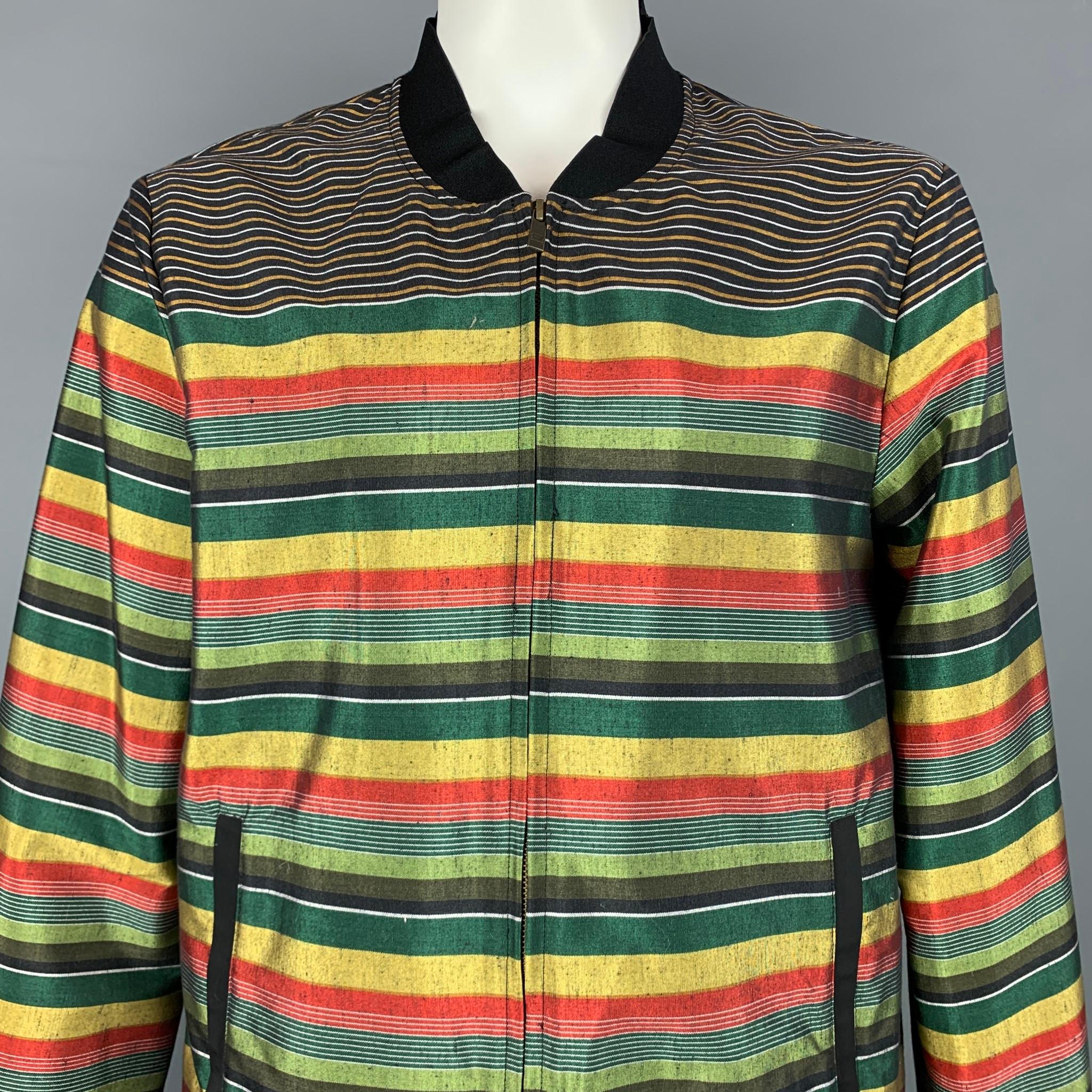 SCOTCH & SODA jacket comes in a multi-color stripe cotton / polyester featuring a bomber style, slit pockets, and a zip up closure.

Very Good Pre-Owned Condition.
Marked: XL

Measurements:

Shoulder: 19 in.
Chest: 44 in.
Sleeve: 28 in.
Length: 27.5