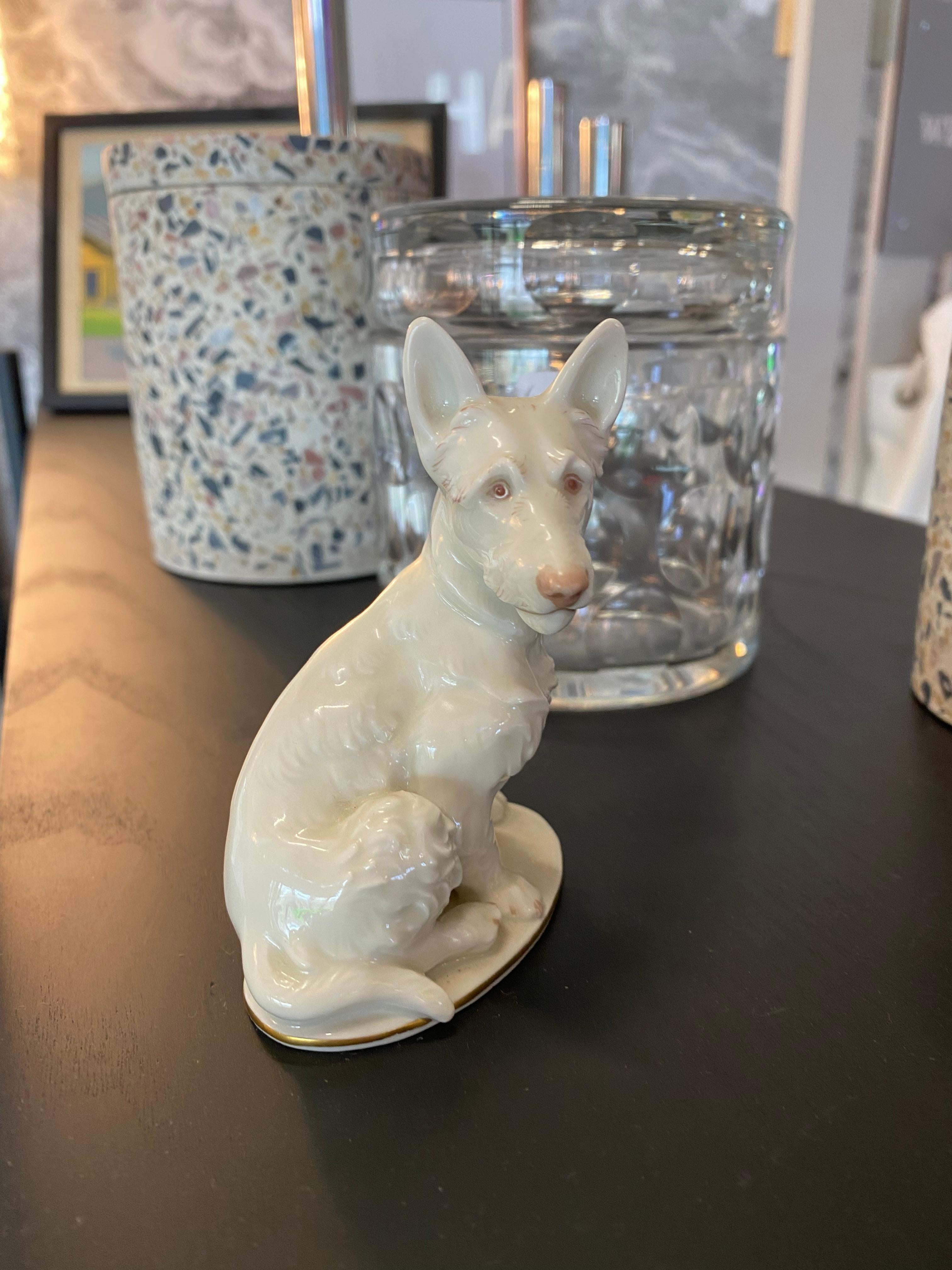 Small white Scotch Terrier made of porcelain by Rosenthal. A fine and naturalistic representation of a sitting Scotch Terrier. The porcelain is glazed white and painted in pastel tones.