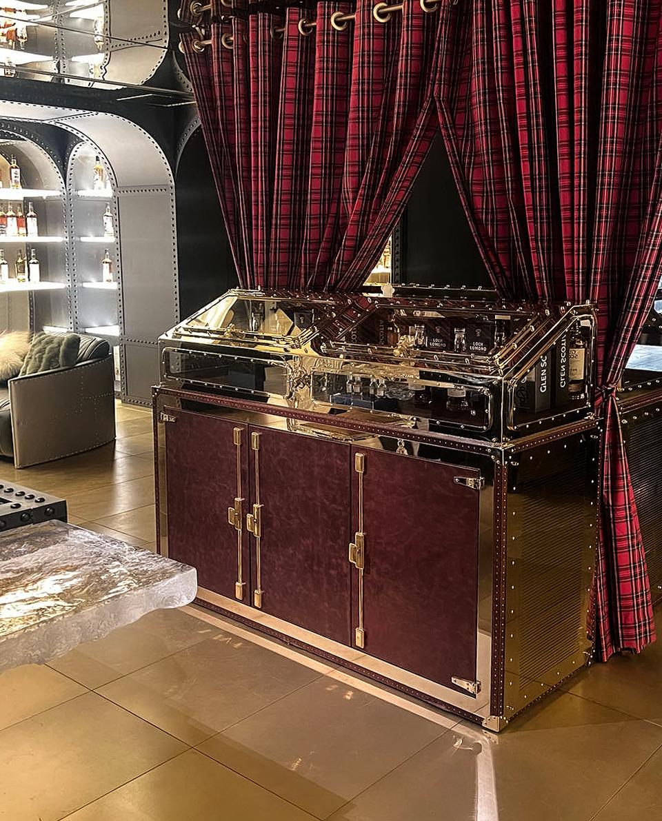 Whisky has a profound meaning in Scottish history and culture related to faith.

The shape of the wine cabinet is taken from the 