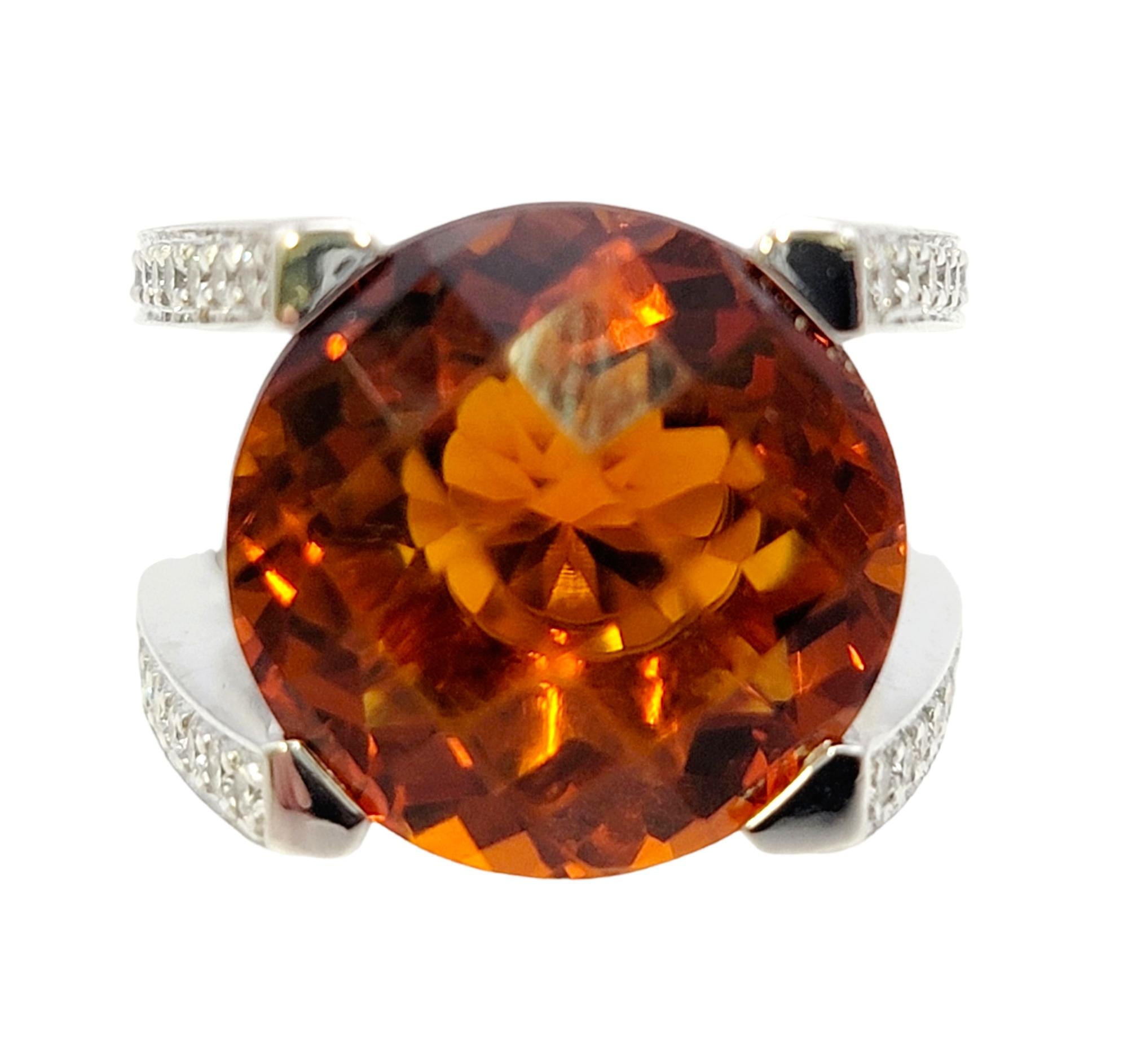Ring size: 7.25

This eye-catching citrine and diamond ring by Scott Gauthier is a real showstopper! Bold in size, color and design, this stunning statement piece sits high off the finger, demanding the viewers attention. The large round cut citrine
