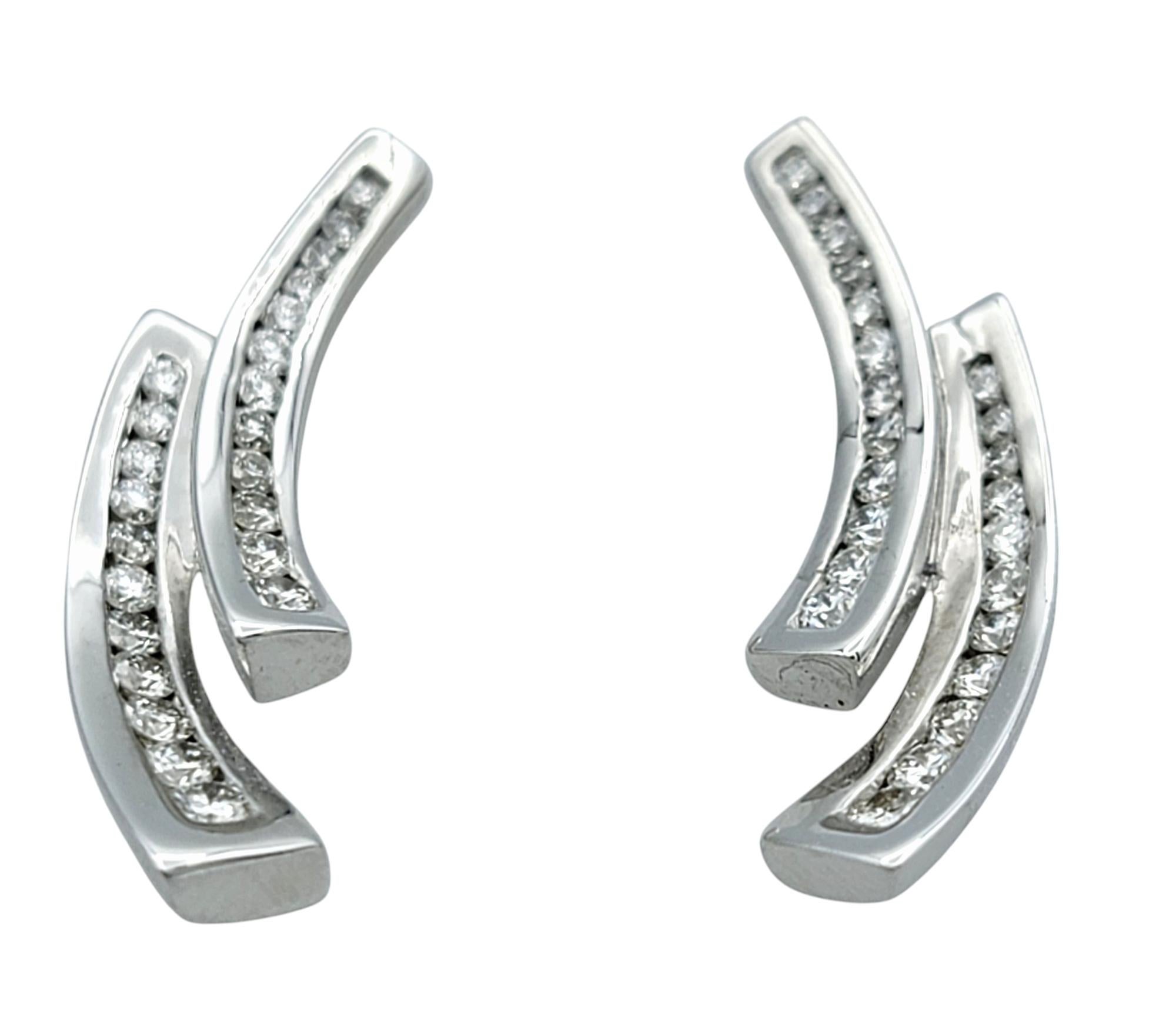 Elevate your style with these striking Scott Gauthier diamond two-row abstract earrings, a perfect blend of modern artistry and timeless luxury. Crafted in 14 karat white gold, these earrings feature a sleek, sculptural design that captures