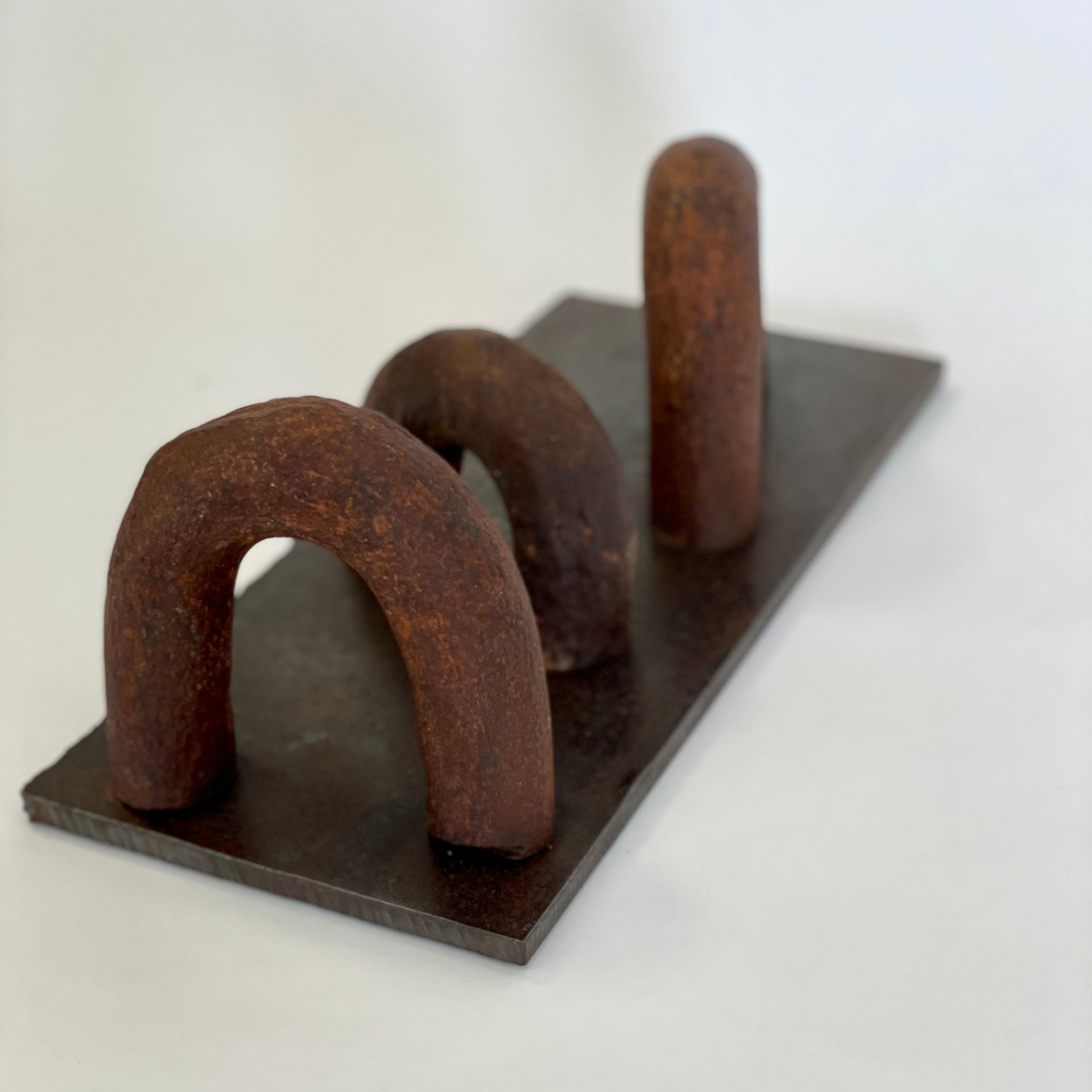 Succession
welded steel
Measures: 6-1/4 x 13-1/2 x 5-1/2 in.

Artist statement:

I seldom use stock material, but prefer distressed and rusted steel that has been scarred, bent, and made imperfect. In this state, the material becomes quite