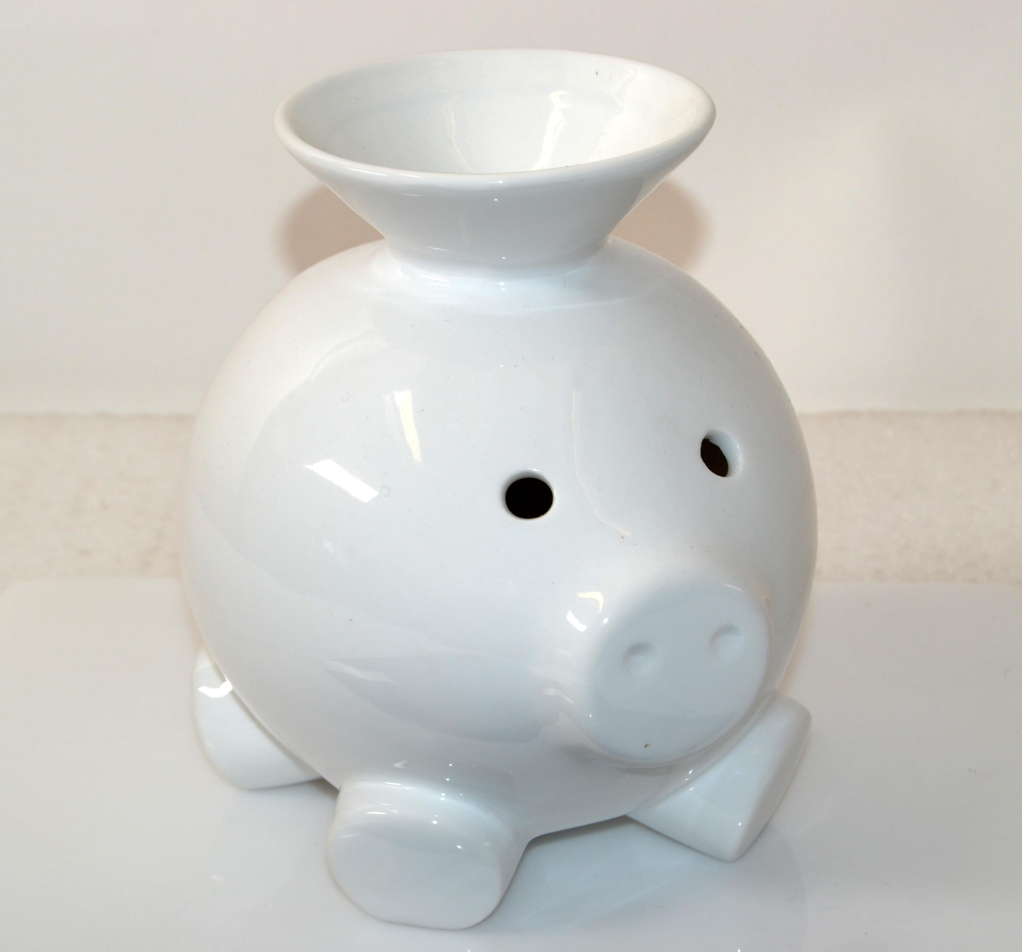 Scott Henderson Design for Mint Inc. White porcelain open top pig, piggy bank, animal sculpture Mid-Century Modern.
Marked at Base, Makers Trademark.
Top fill-funnel makes it easy to collect the change, coins easily.
This Collectible Design