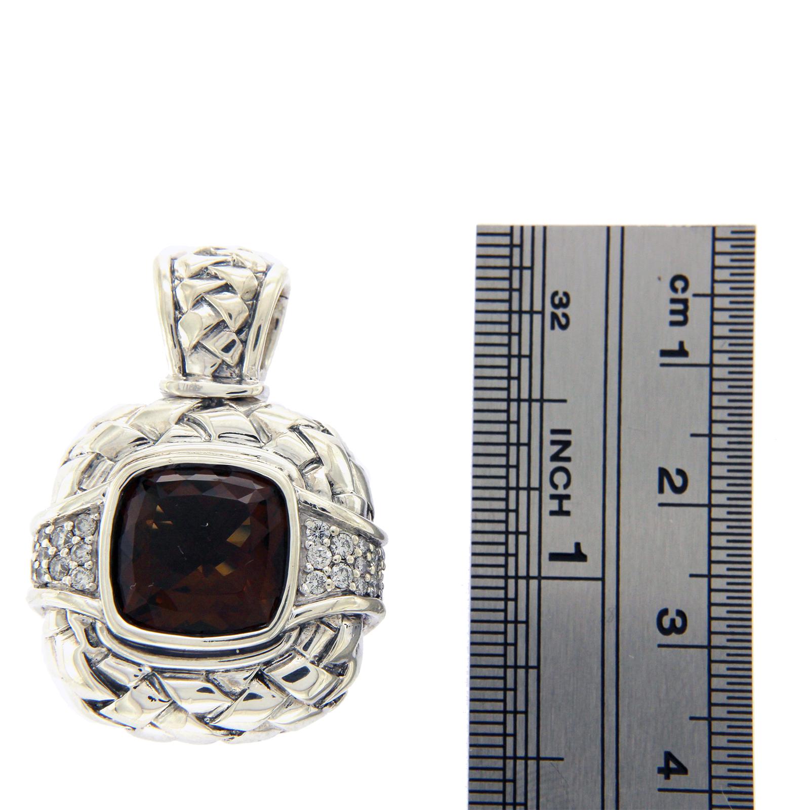 Type: Charm
Height: 35.5 mm
Width:24.5 mm
Metal: Sterling Silver
Metal Purity: 925
Stone Type:Diamonds and Smokey Quartz
Hallmark:SK 925
Total Weight: 17.2 Grams
Condition: Pre Owned
Stock Number: U224