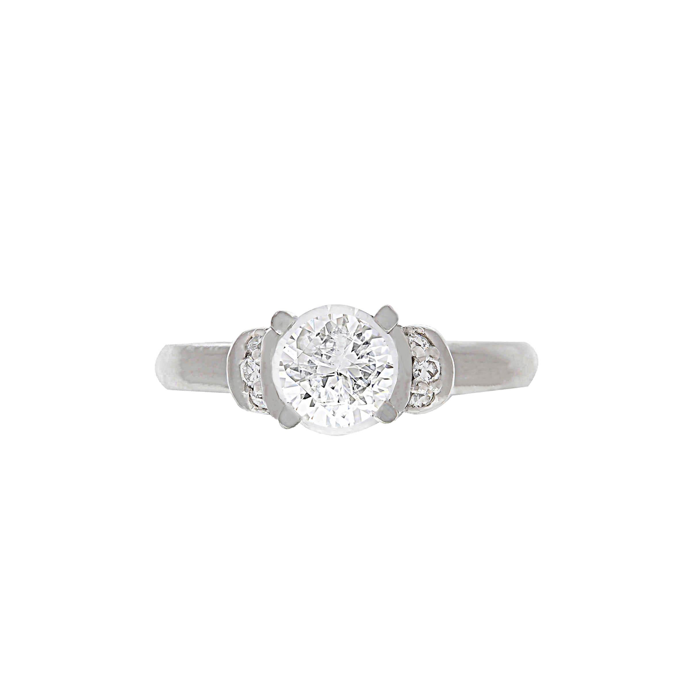Scott Kay platinum engagement ring containing one GIA certified round brilliant cut diamond weighing 1.05 carats, G color, VS2 clarity. The mounting contains 0.16 carat of diamonds, G color, VS clarity.
This ring can be sized.