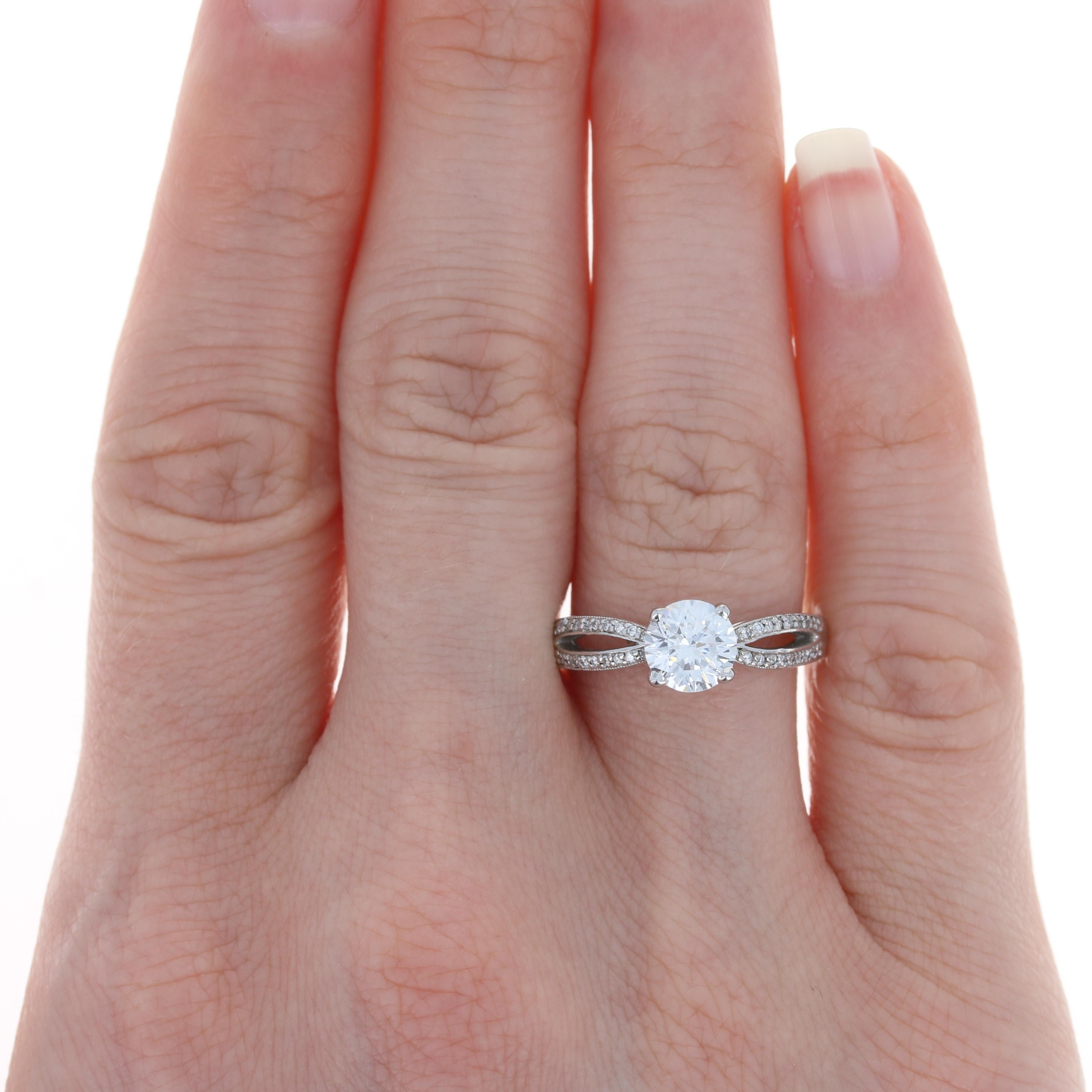 Showcase your beautiful diamond or heirloom gemstone in an elegant band! Created by Scott Kay in 19k white gold and featuring natural diamond accents, this stylish semi-mount will accommodate a diamond or gemstone solitaire measuring approximately