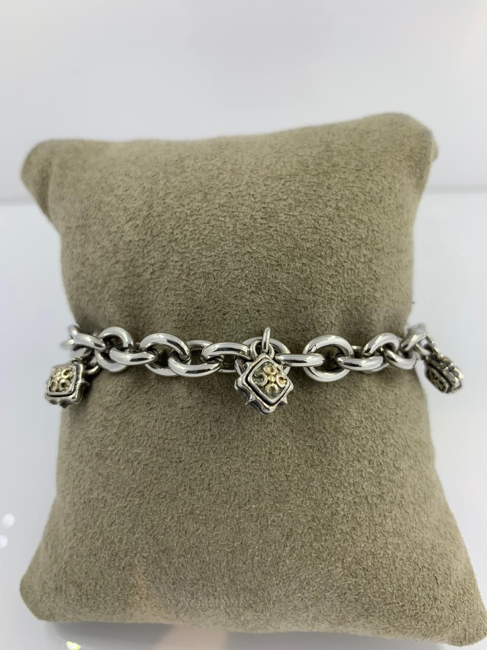 Scott Kay Silver and Gold Bracelet
1 row silver and 18kt Gold Bracelet
with charms
SKS-10232