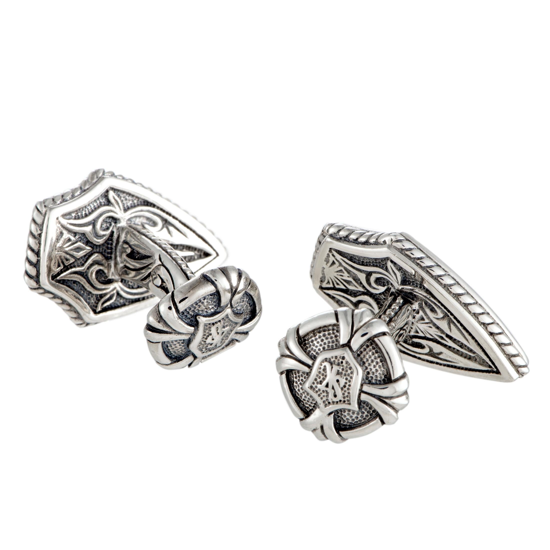 Slightly reminiscent of medieval shields stylized in an exquisitely ornamental fashion, these stunning, extraordinarily designed cufflinks will add a compellingly edgy feel to your evening attire. The pair is presented by Scott Kay, and the