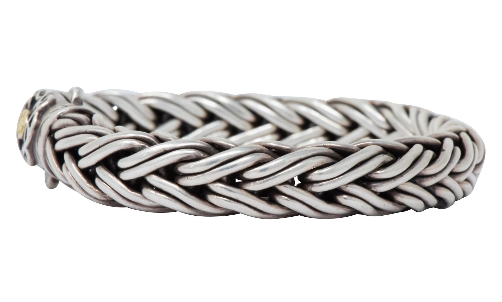 Thick woven sterling silver bracelet with thorn design on clasp

Completed by double presser clasp with applied gold maker's mark

From Scott Kay Doberman collection

Fully signed Scott Kay and stamped 750 and 925

Length: 8 1/2 inches

Width: 1/2