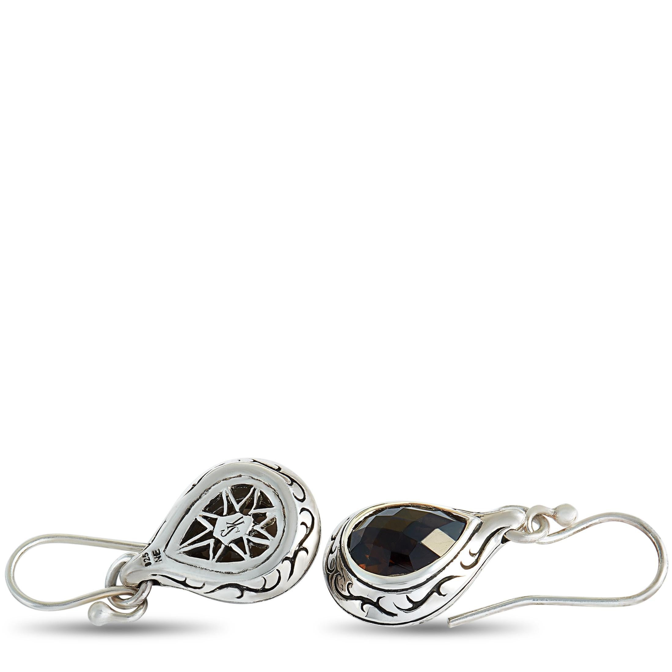 These Scott Kay earrings are made of sterling silver and embellished with smoky quartz stones. The earrings measure 1.20” in length and 0.50” in width and each of the two weighs 3.75 grams.

Offered in brand new condition, this pair of earrings