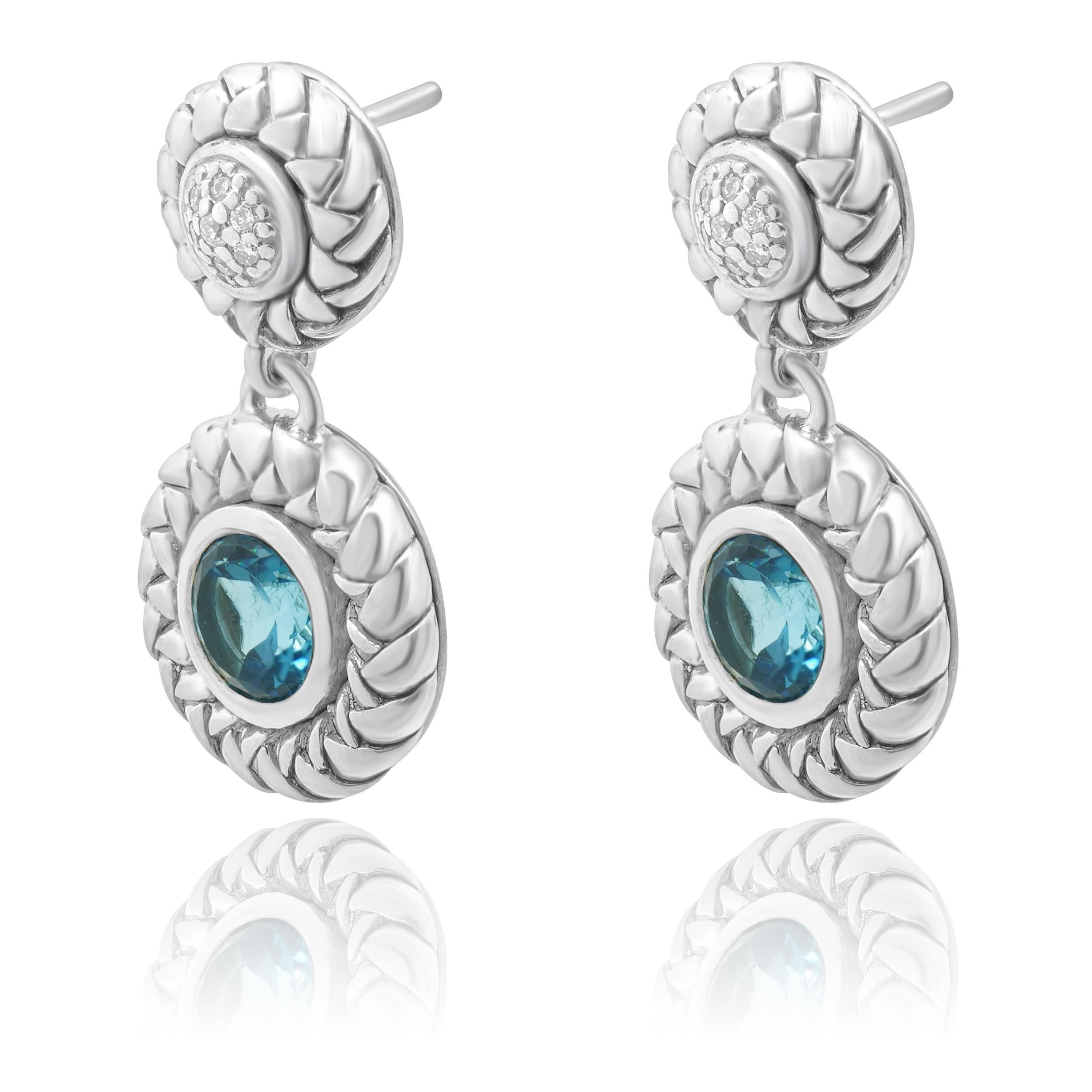 Designer: Scott Kay
Material: sterling silver
Diamond: round cut = 0.15cttw
Color: H
Clarity: SI1
Blue Topaz: 4.00cttw
Dimensions: earrings measure approximately 31.7mm x 17mm
Weight: 14.73 grams
