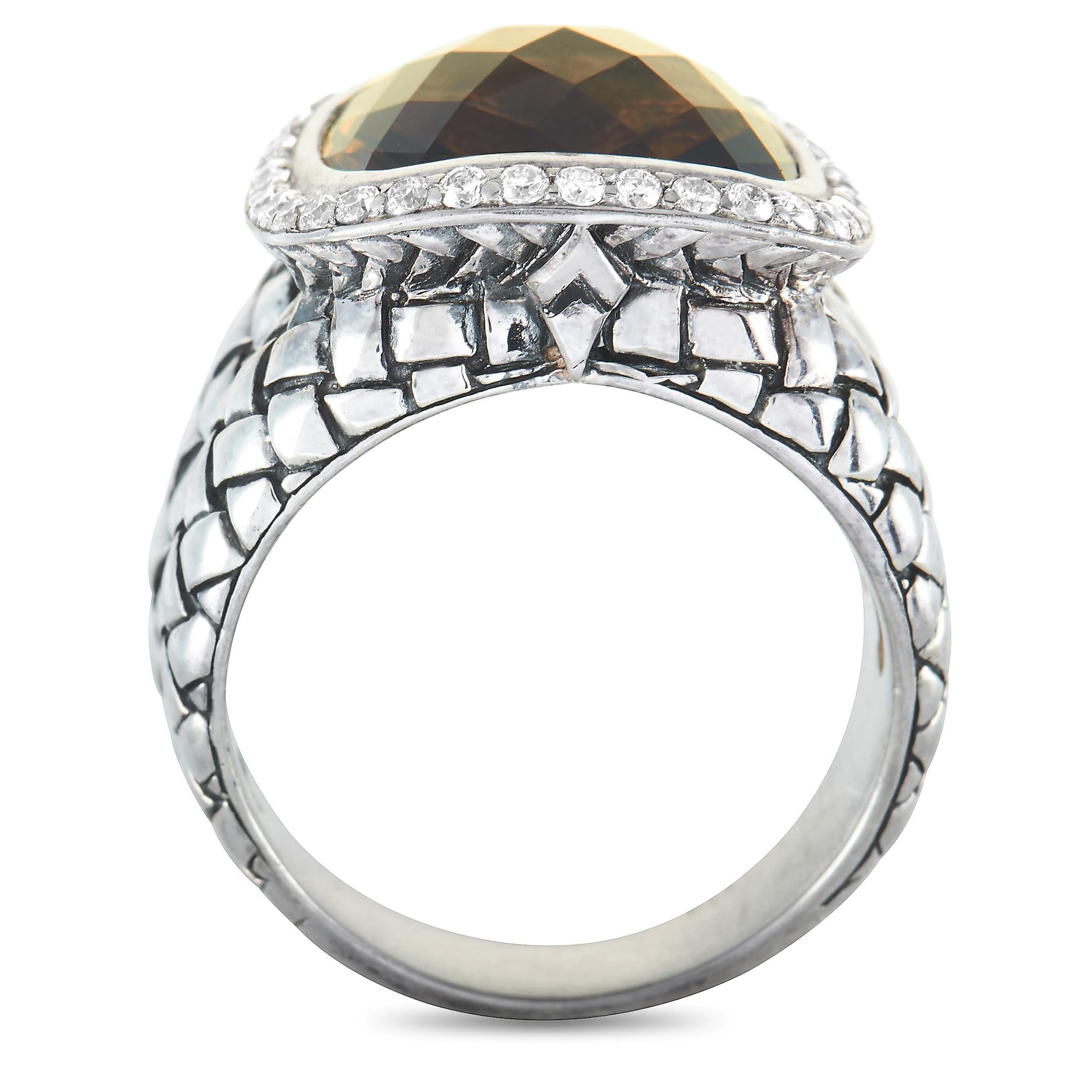 This Scott Kay ring is crafted from sterling silver and weighs 11.9 grams, boasting band thickness of 5 mm and top height of 10 mm, while top dimensions measure 16 by 16 mm. The ring is set with diamonds and a quartz stone.

Offered in brand new