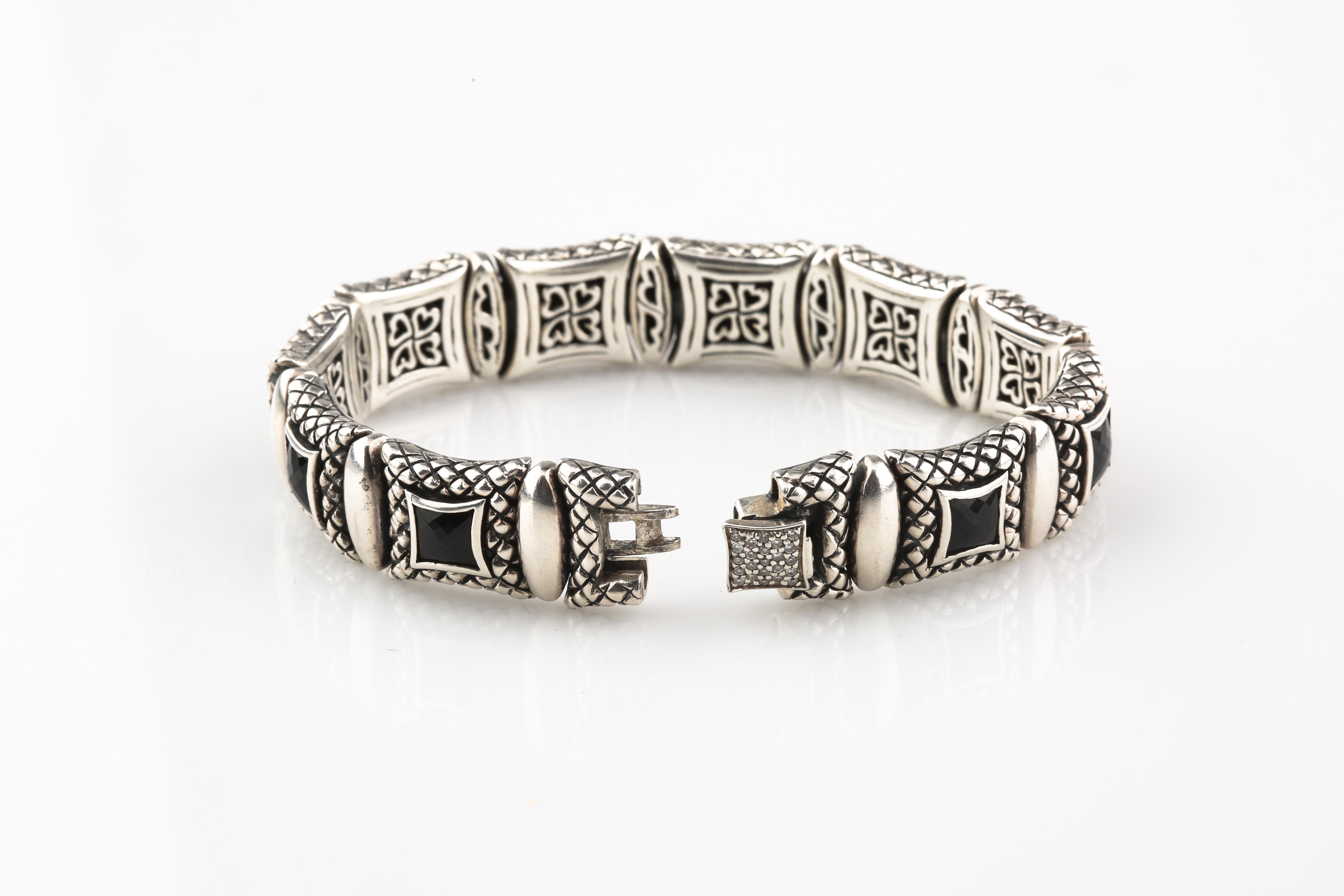 Sterling Silver Equestrian Link Bracelet
Each Etched Plaque Features a Faceted Onyx on the Front and Delicate Filigree on the Back
Clasp has Diamond Accents instead of Onyx. NOTE: Clasp is a little loose
7