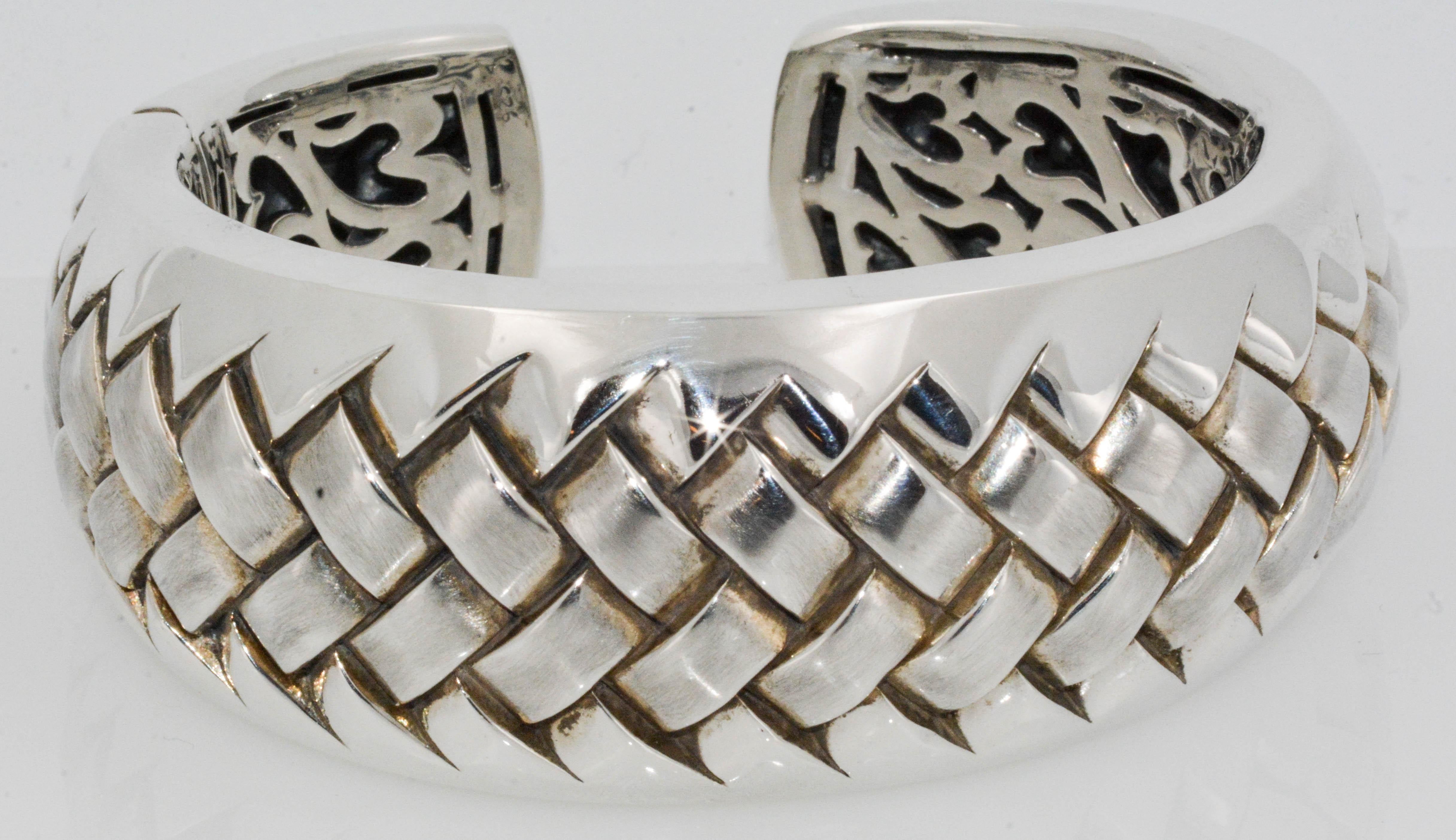 An appealing Sterling Silver Scott Kay cuff bracelet with his signature stamp on the underside. This superb cuff bracelet has a comfortable latch opening that is very discreet.  This cuff bracelet is remarkable with its woven texture and design as