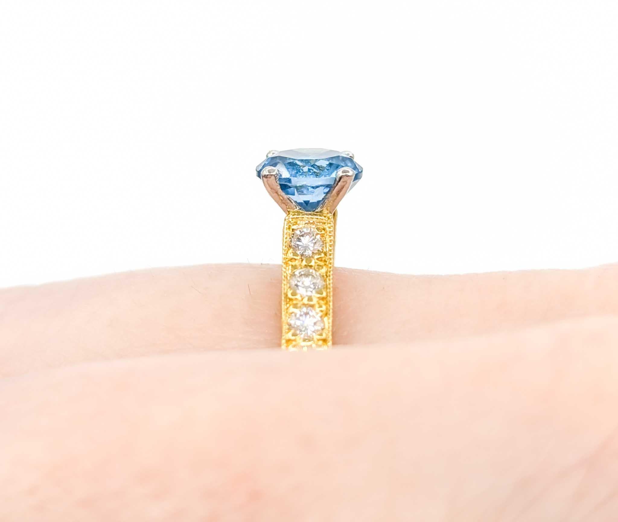 Beautiful Scott Kay Topaz & Diamond Ring in Yellow Gold & Platinum

Introducing this exquisite Topaz fashion ring crafted in luxurious 18k yellow gold and platinum. The ring features a 1.70ct blue topaz centerpiece with a .24ctw in round diamond