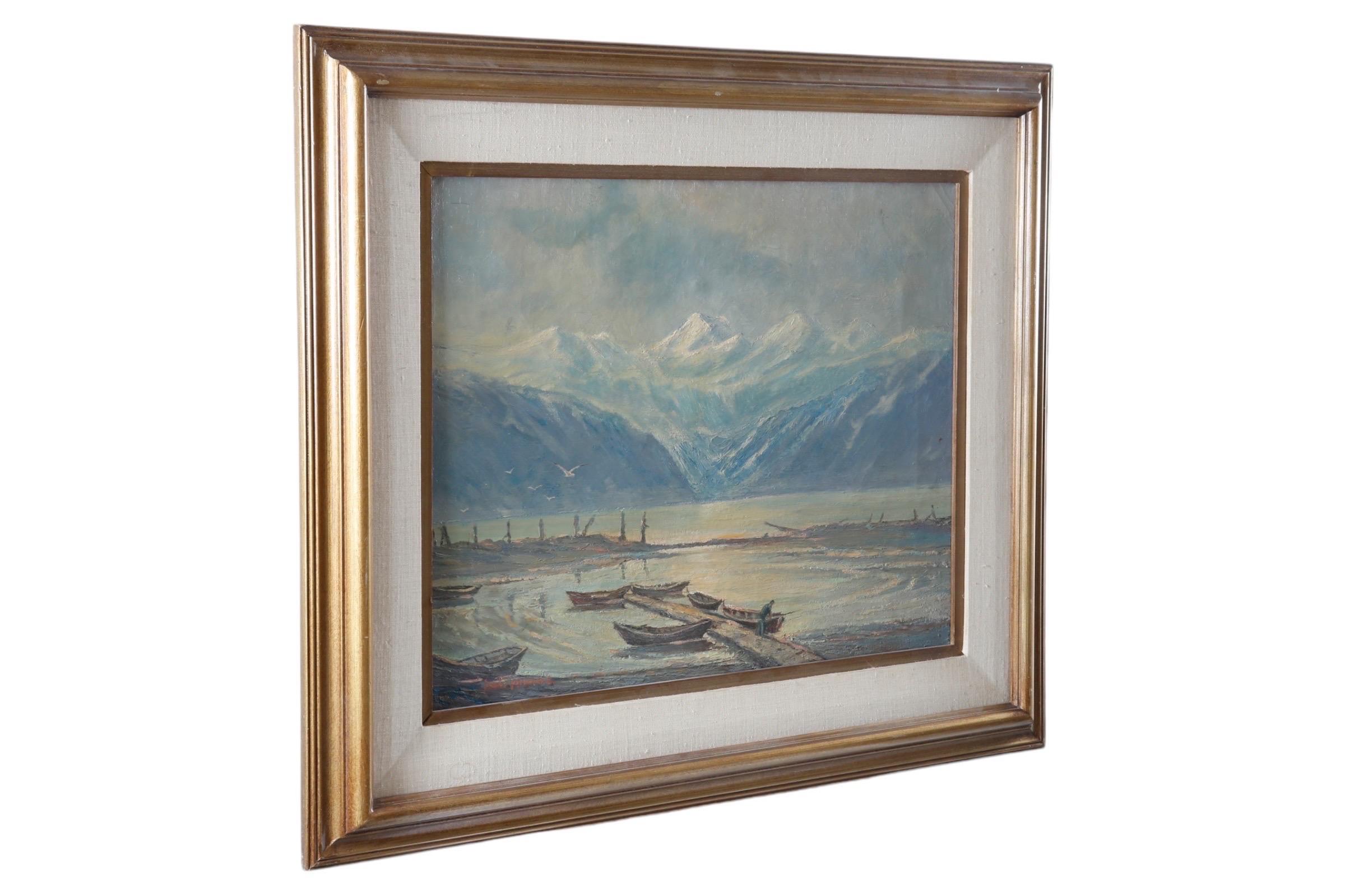 Signed oil on canvas by listed Alaskan artist Scott McDaniel (1926-2012). The painting depicts seven small boats docked at low tide and a fisherman, before bright mountain peaks. Shorebirds fly from the left across the calm water, providing a quiet