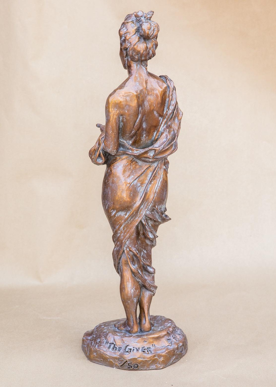 Bronze sculpture signed/etched by the Artist on bronze base with an edition number.
5/50