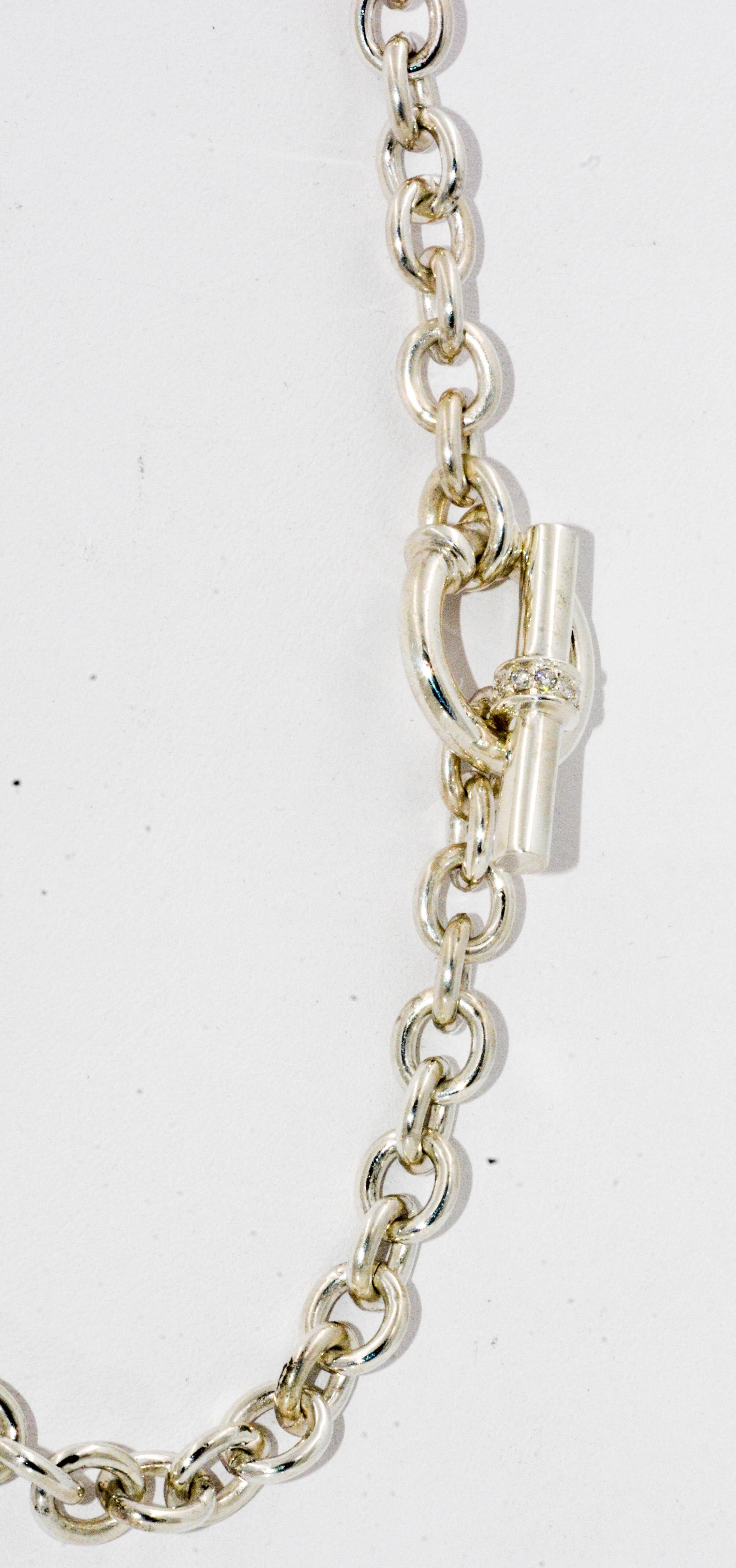 Sterling silver links are subtly jazzed with a little bling on the diamond studded toggle clasp. This simple link chain still looks fabulous and is circa 1980s. The necklace measures 16 inches, and feels quite substantial. If you love sterling