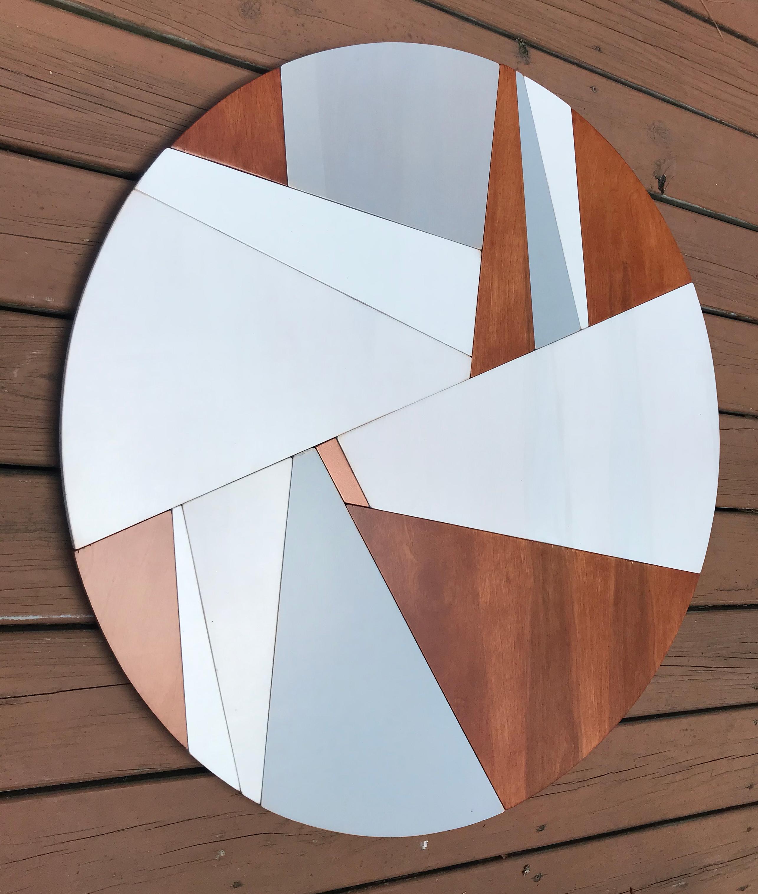 Holocene 2 is an elegant modern minimalist contemporary wall sculpture. It is constructed
with birch panels, acrylic and latex washes and copper metallic enamel with a satin
lacquer clear coat finish. It is completed with a gray MDF backer. The