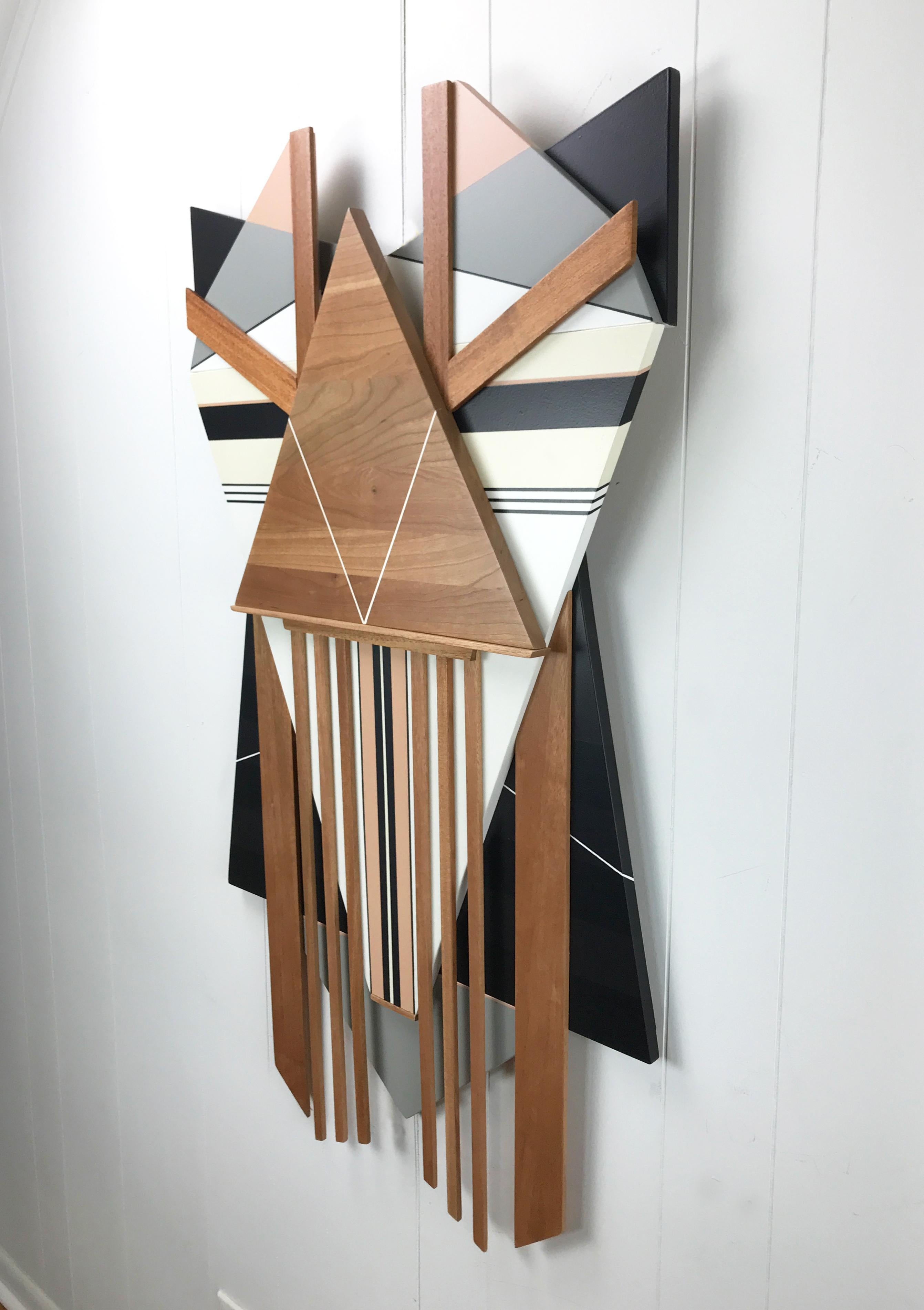 Ronin II is a mixed media wall sculpture. Constructed from repurposed cherry hardwood, mahogany and MDF and finished with enamel and semi-gloss lacquer. 

I try to create work that transcends time. Meaning that I like my pieces to feel as though