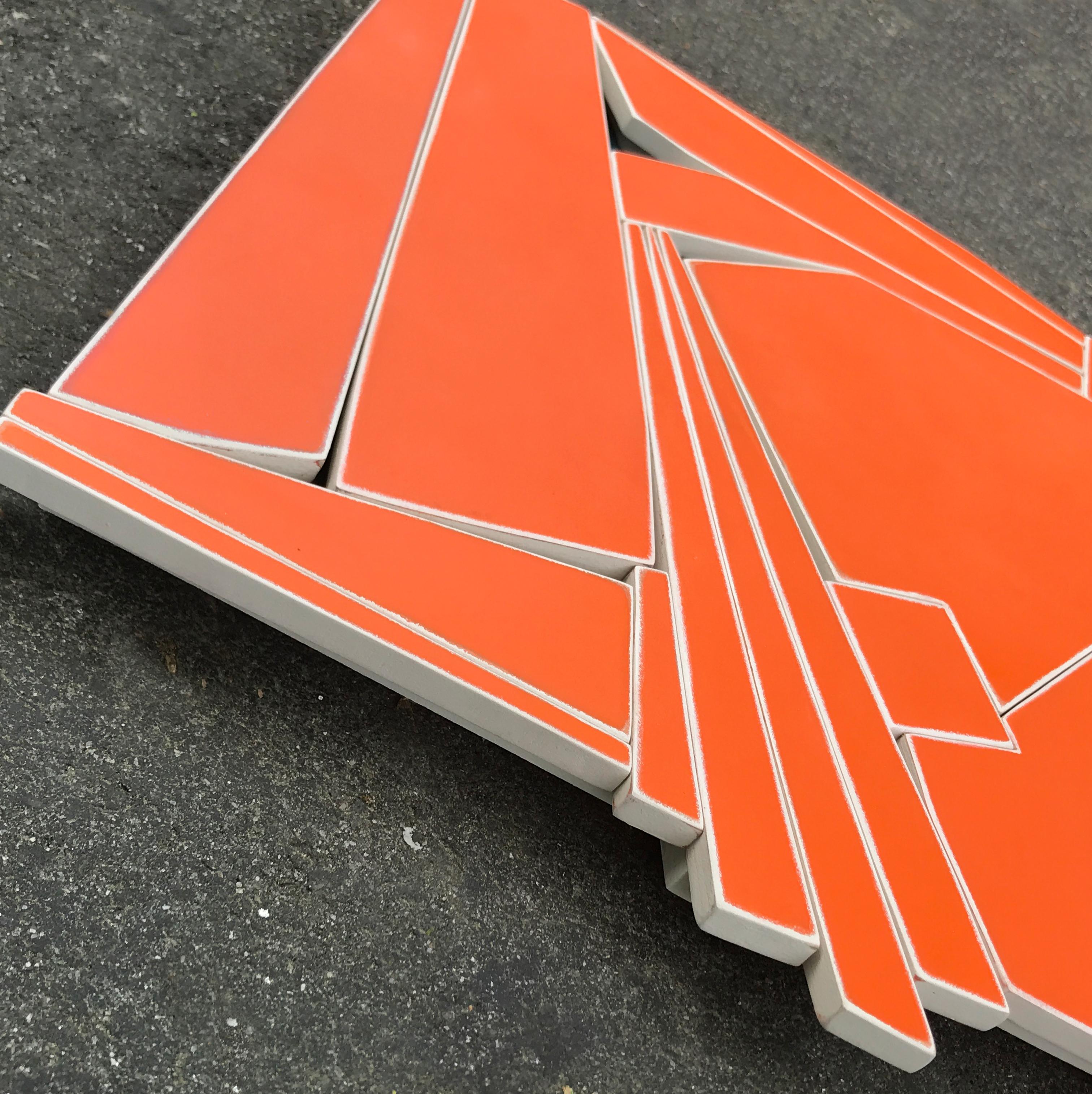 Tangerine is a modern mixed media wall sculpture, constructed from MDF, acrylic and varnish. The bold but limited monochrome color palette emphasizes the form and composition over a broad color palette. I designed this piece to be somewhat