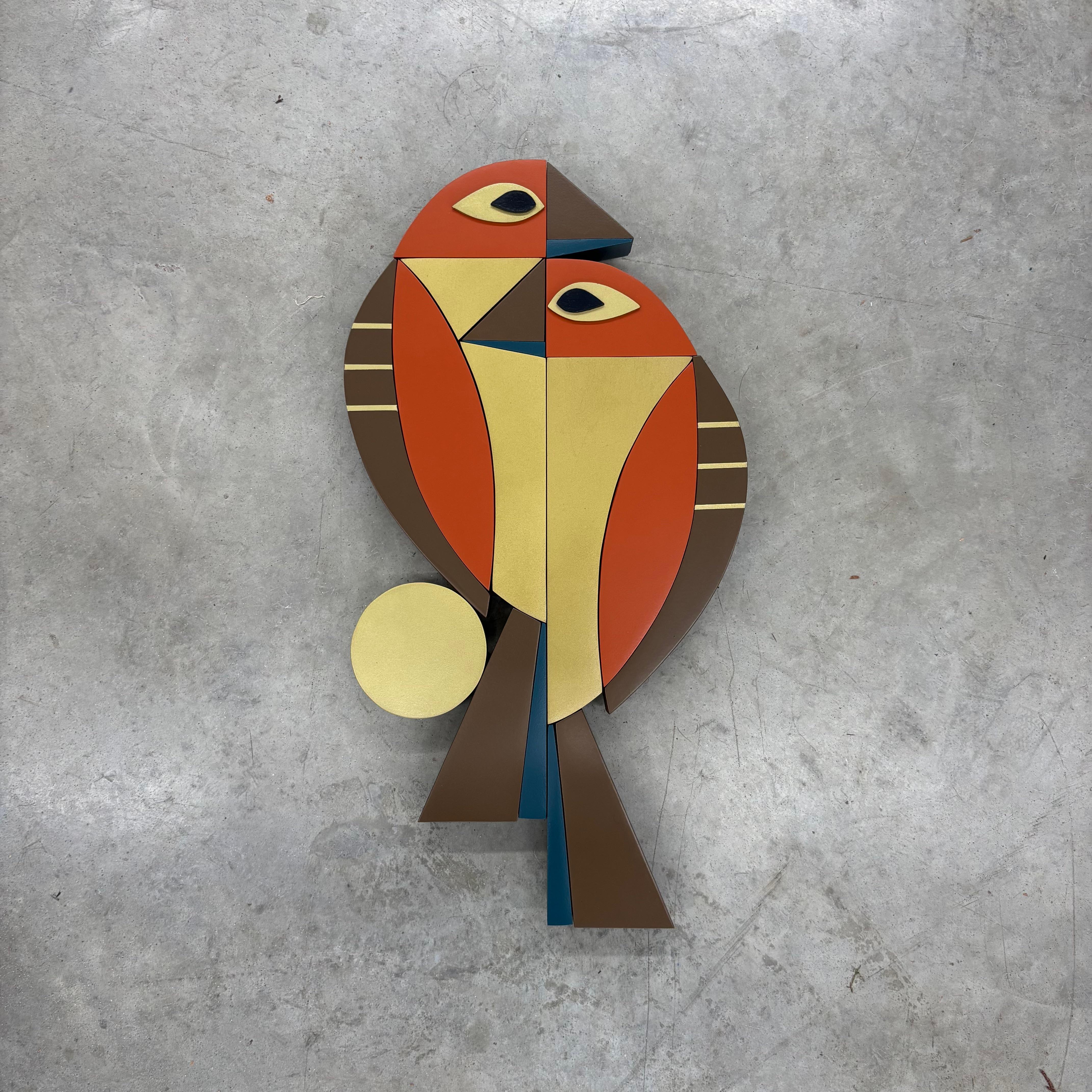 This striking wall sculpture by artist Scott Troxel transforms a pair of birds into a bold geometric abstraction, merging playful figuration with his signature retro-modern design language. Constructed from layered wood elements, the composition