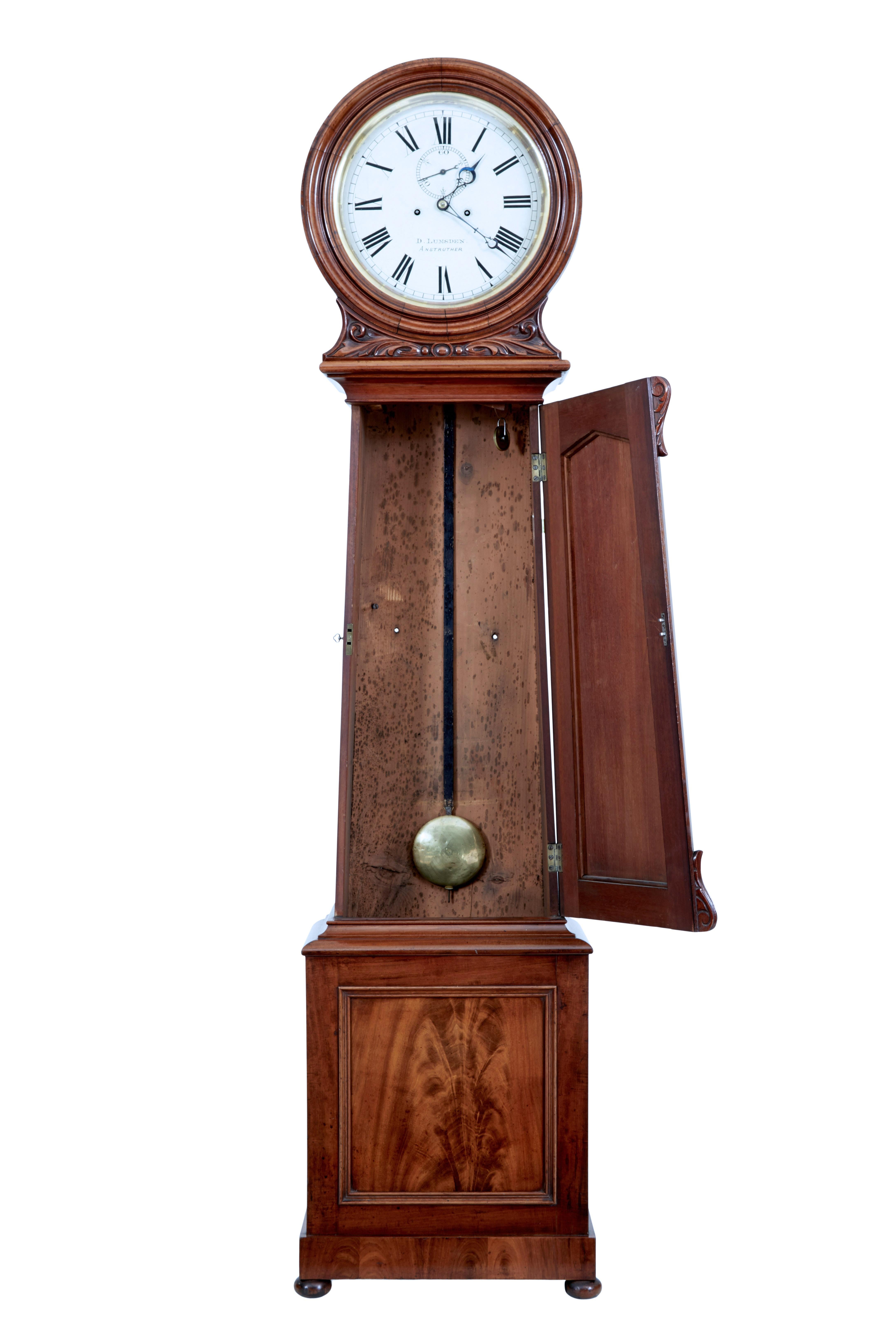 Scottish 19th century carved mahogany long case clock by Lumsden circa 1874.

Fine quality long case clock baring the makers name on the face, D Lumsden, and marked Anstruther which is a town in Scotland, where he was based.

White enamel dial
