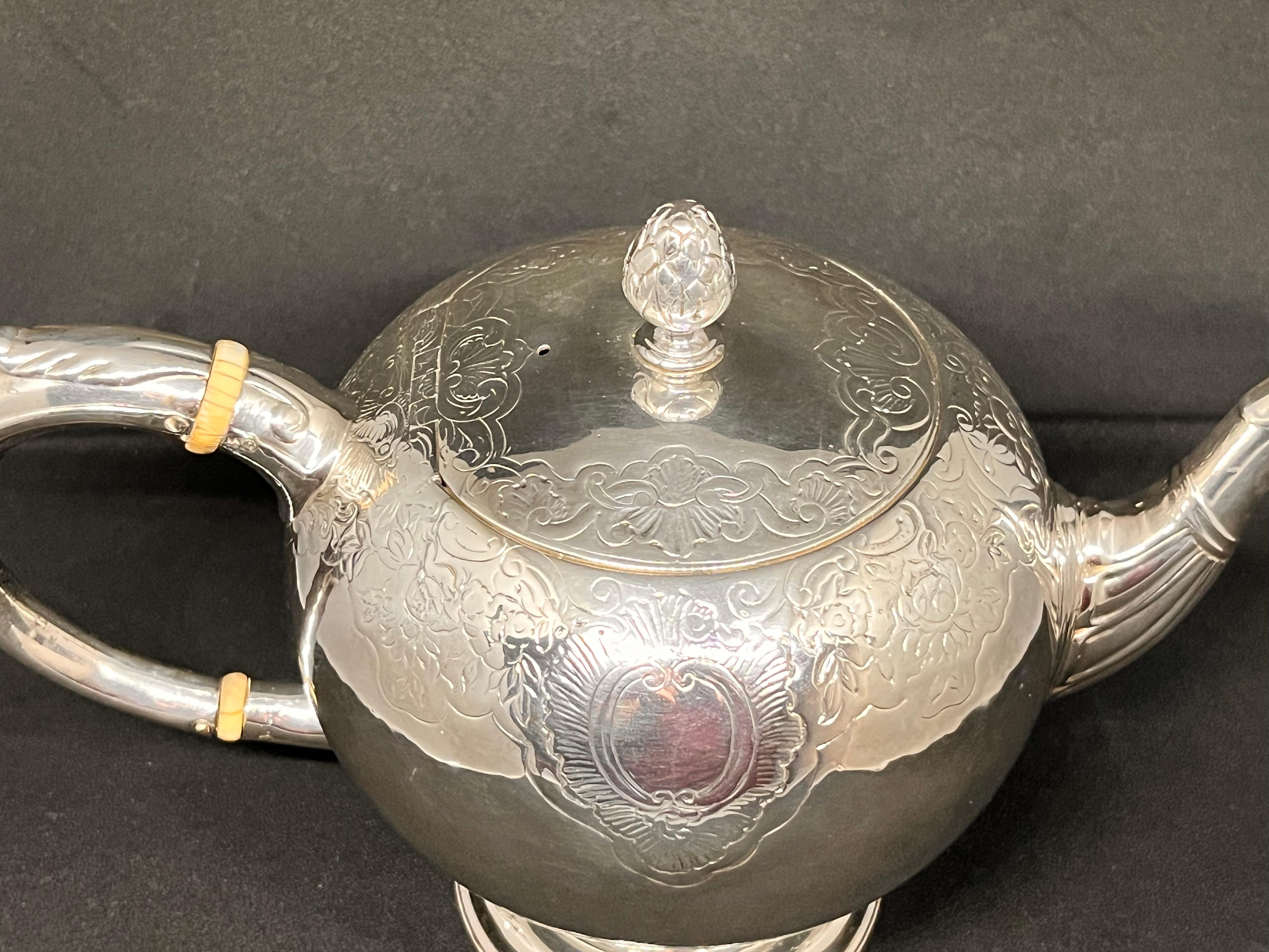 Mid-18th Century Scottish. A Rare Mid-Eighteenth-Century George II Rococo Silver Bullet Teapot.
