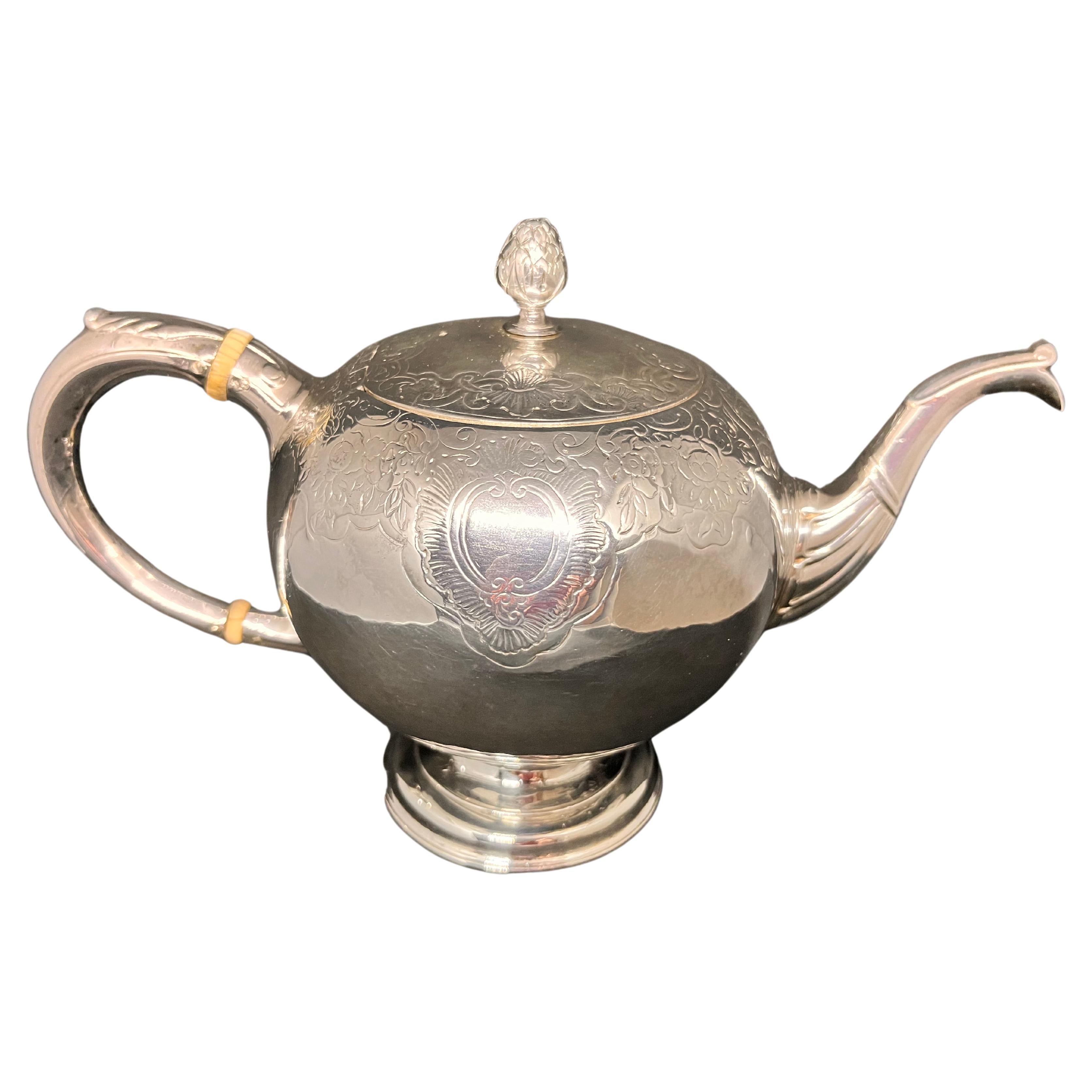 Scottish. A Rare Mid-Eighteenth-Century George II Rococo Silver Bullet Teapot.