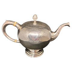 Scottish. A Rare Mid-Eighteenth-Century George II Rococo Silver Bullet Teapot.